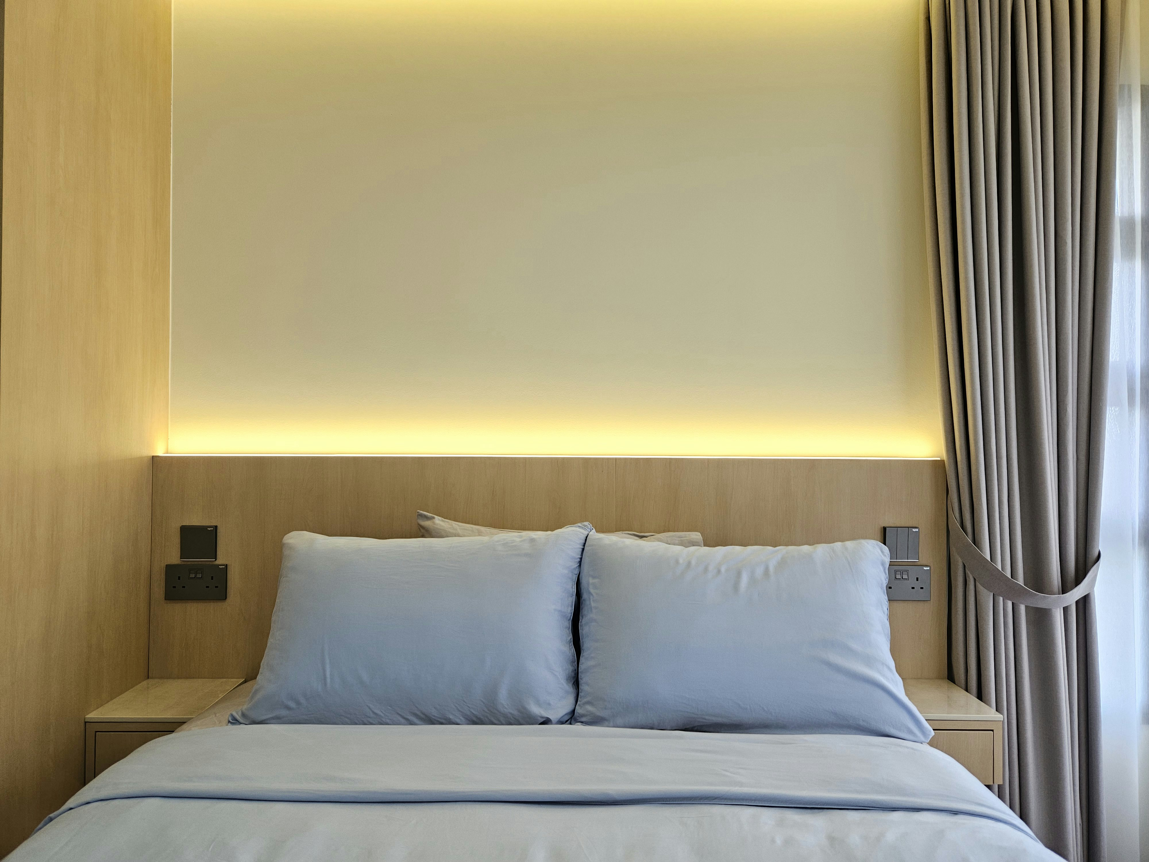 Retreat Into Our Zen Bedroom - Modern minimalist bedroom, neutral color palette, large bed with light blue bedding, built-in