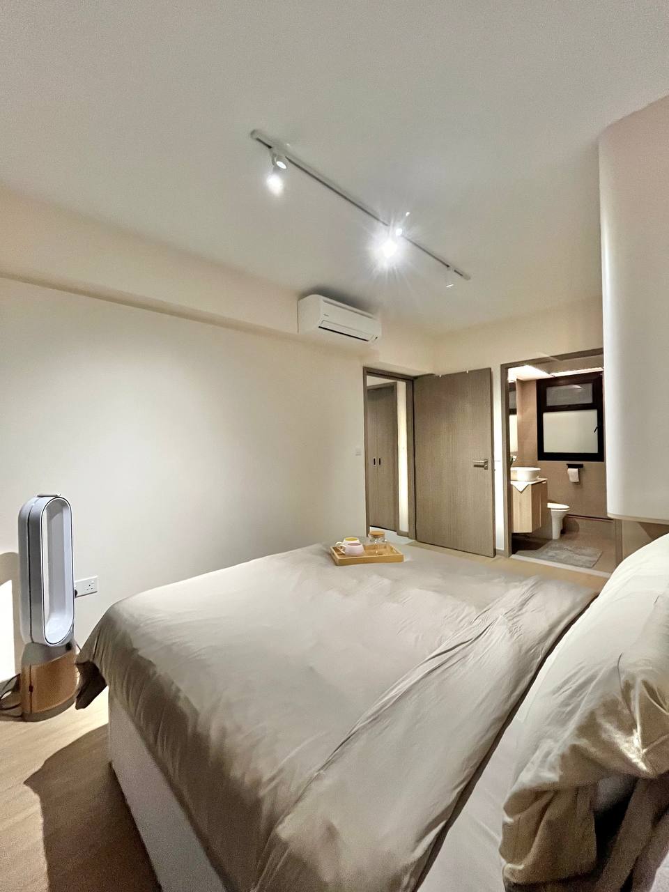 Master Bedroom: Going Basic with a Near Monochromatic Look - Modern minimalist bedroom with beige bedding, sleek wooden