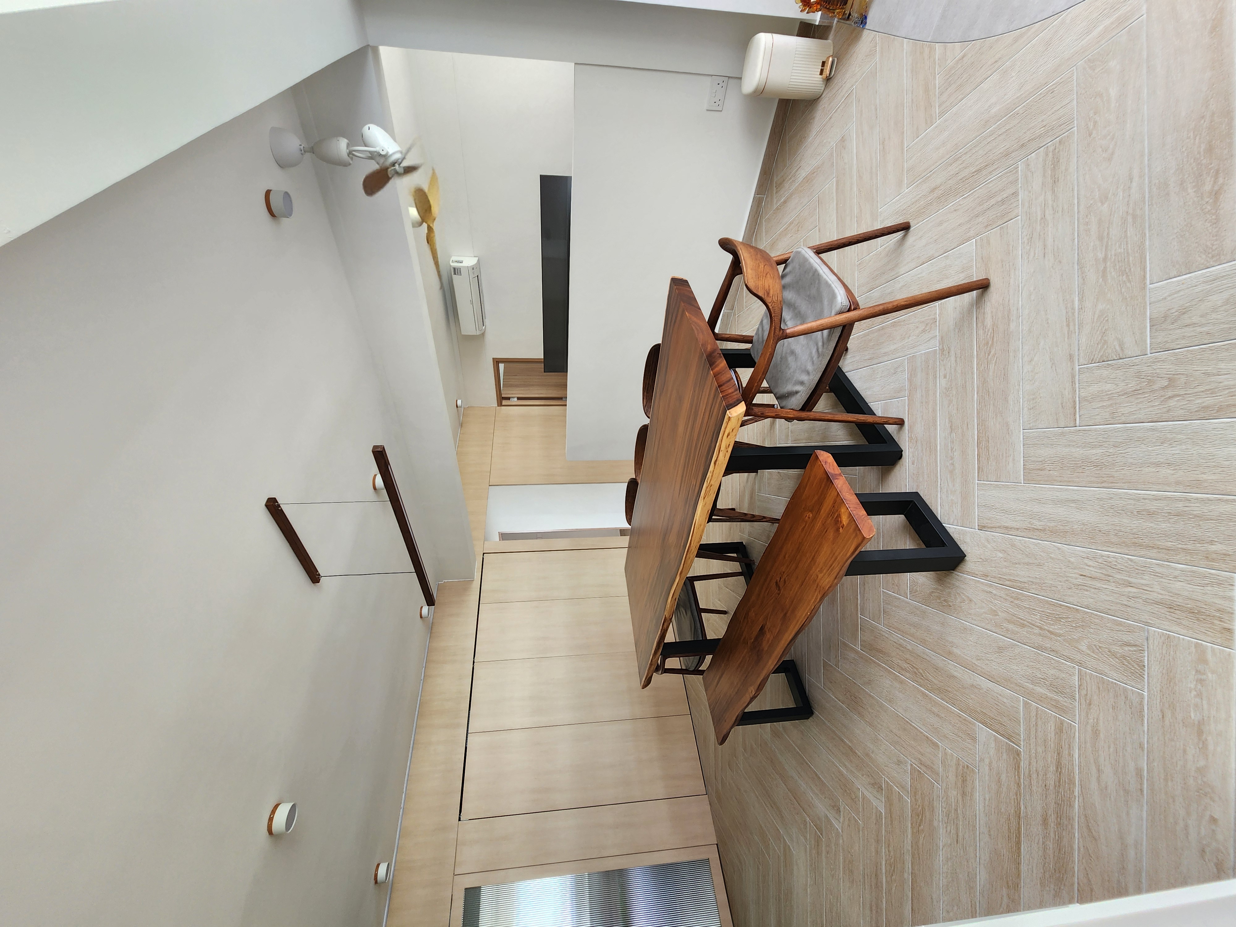 Spent 4k to Reconnect? - Modern minimalist interior, wooden chairs, herringbone tile wall, sleek ceiling fan, white