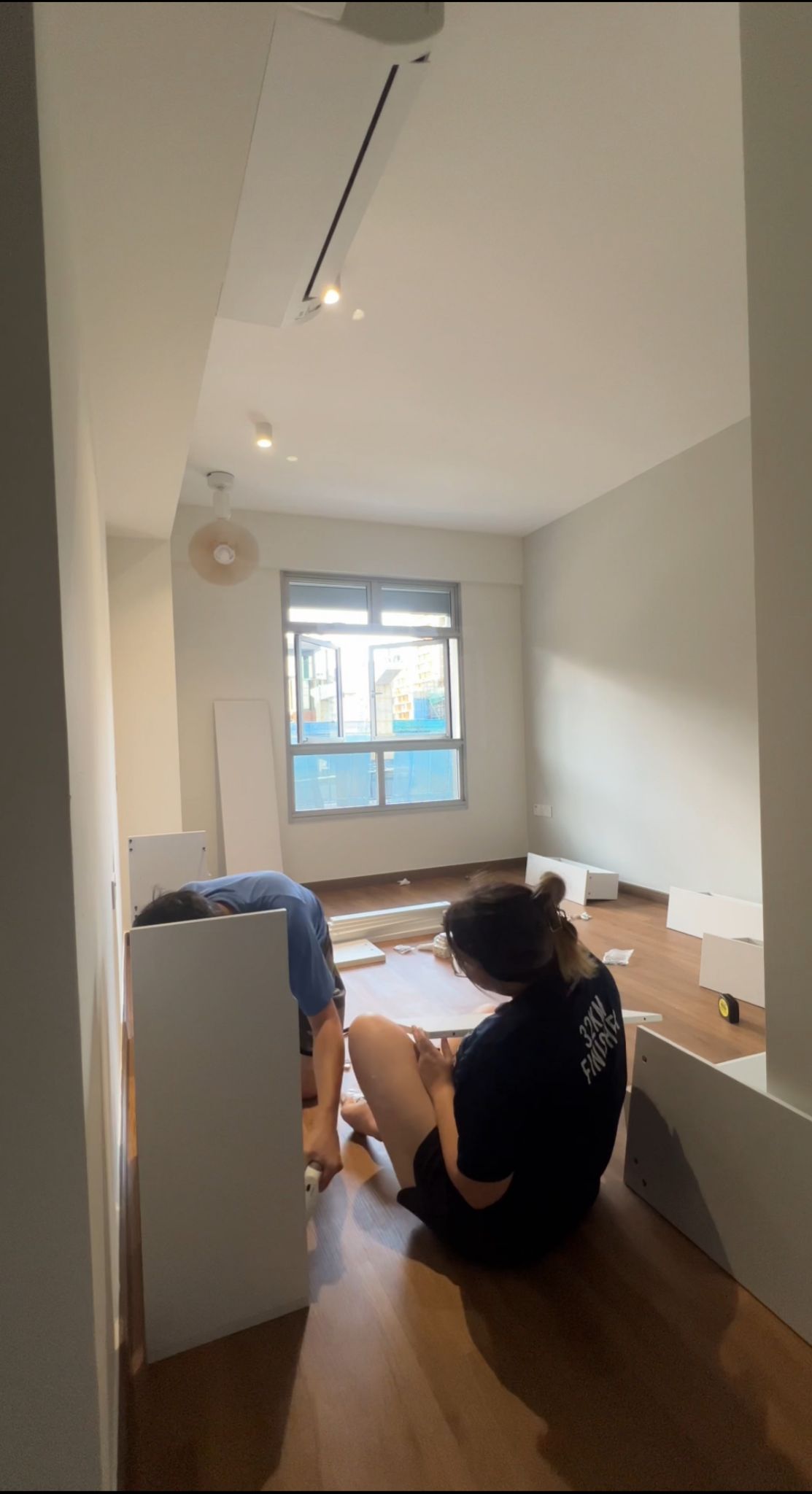 Serenity in our bedroom. - Interior renovation in progress, Two individuals assembling furniture, White walls and wooden