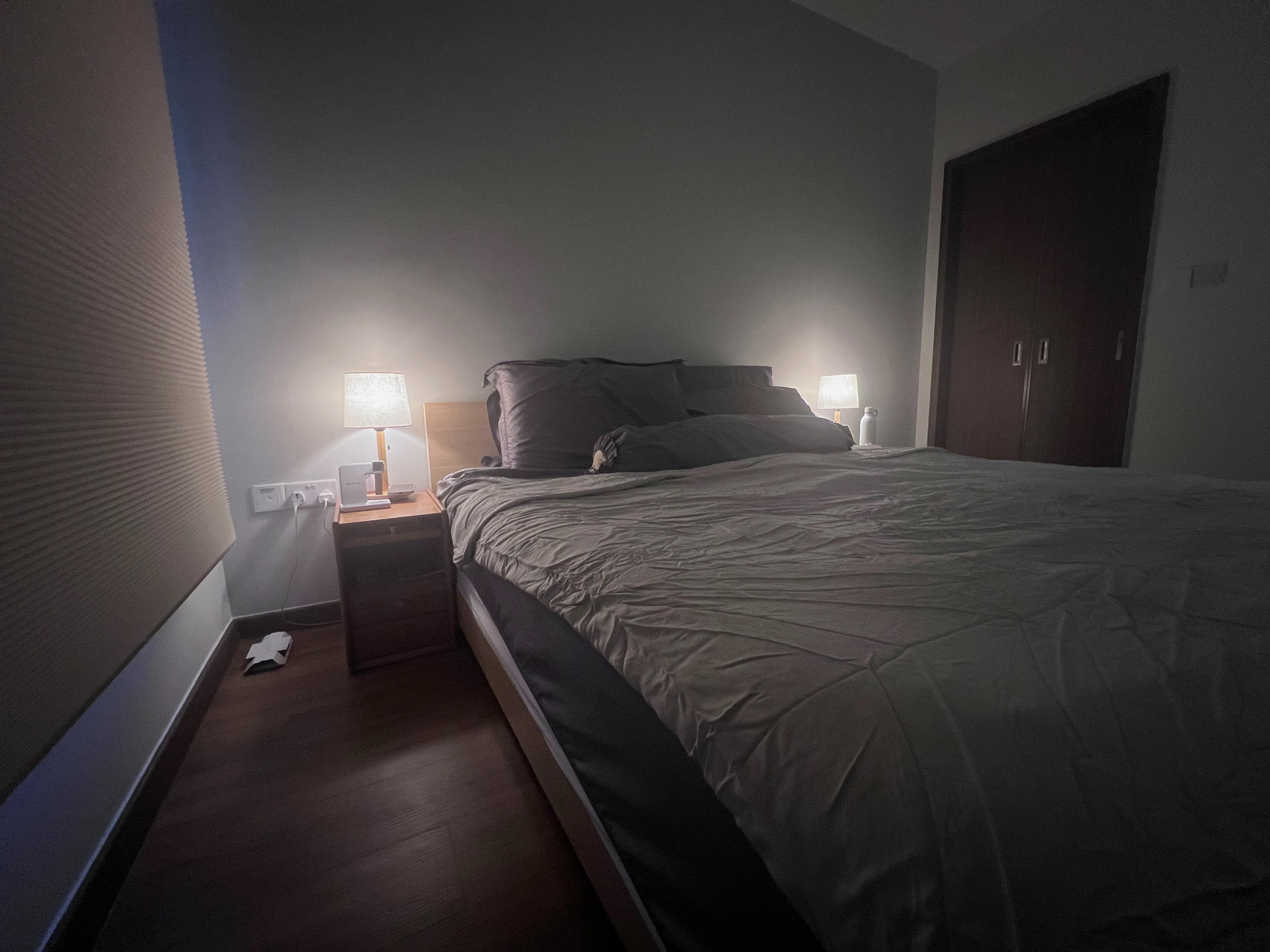 Serenity in our bedroom. - dimly lit bedroom, cozy atmosphere, bedside tables, soft lighting, nightstands, neatly made bed