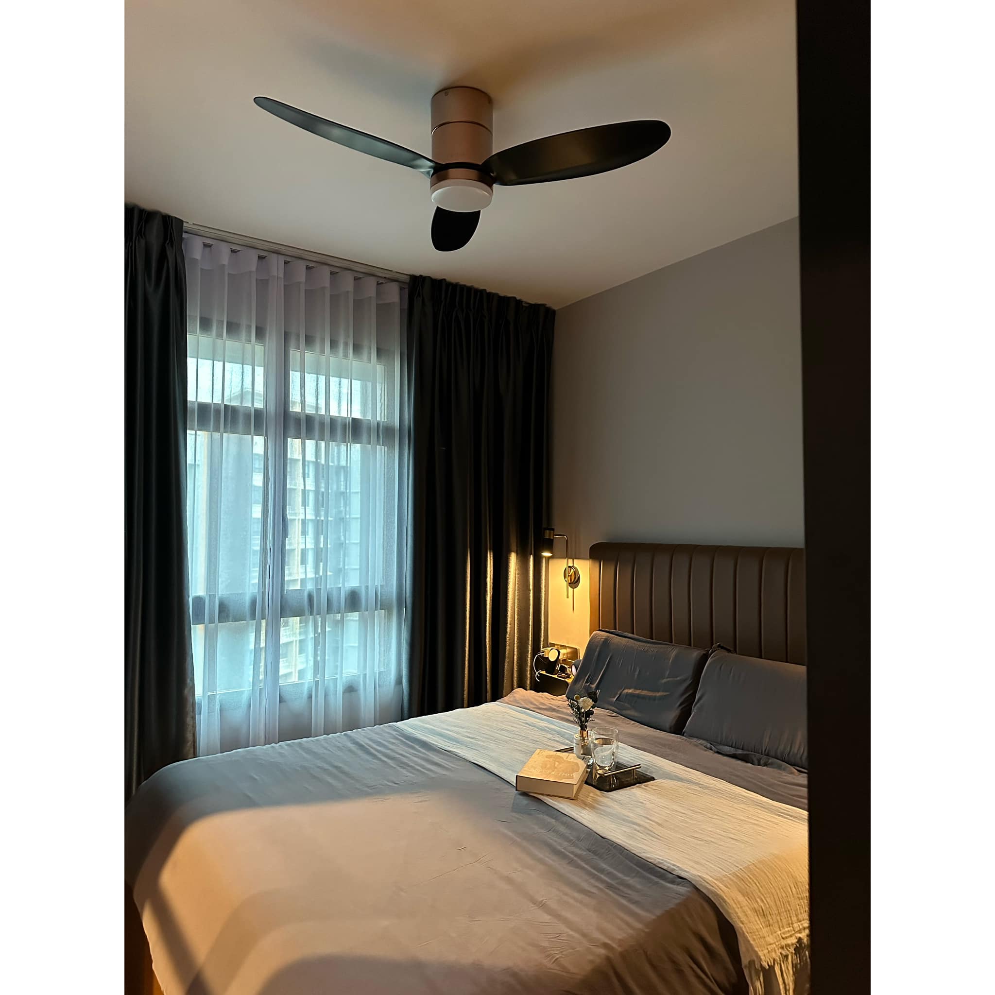 A Modern-luxe Haven, An Elegant Retreat - Modern bedroom with ceiling fan, large bed with gray and white bedding, soft