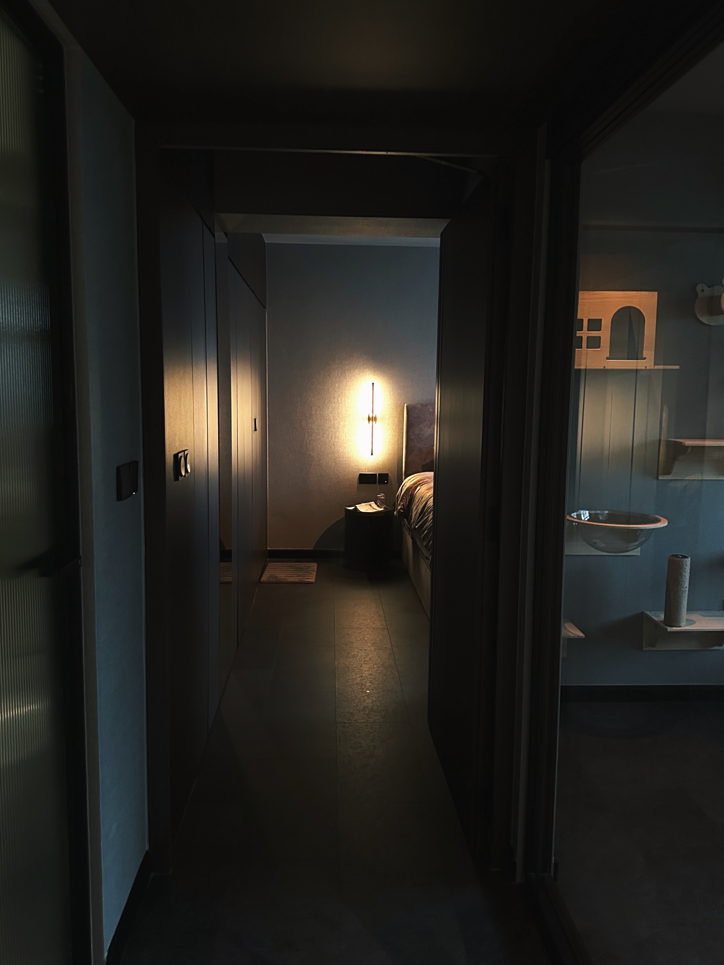 Finding Comfort: A Glimpse into Our Cozy and Minimalist Bedroom - dimly lit hallway, modern interior, cozy room, minimalist