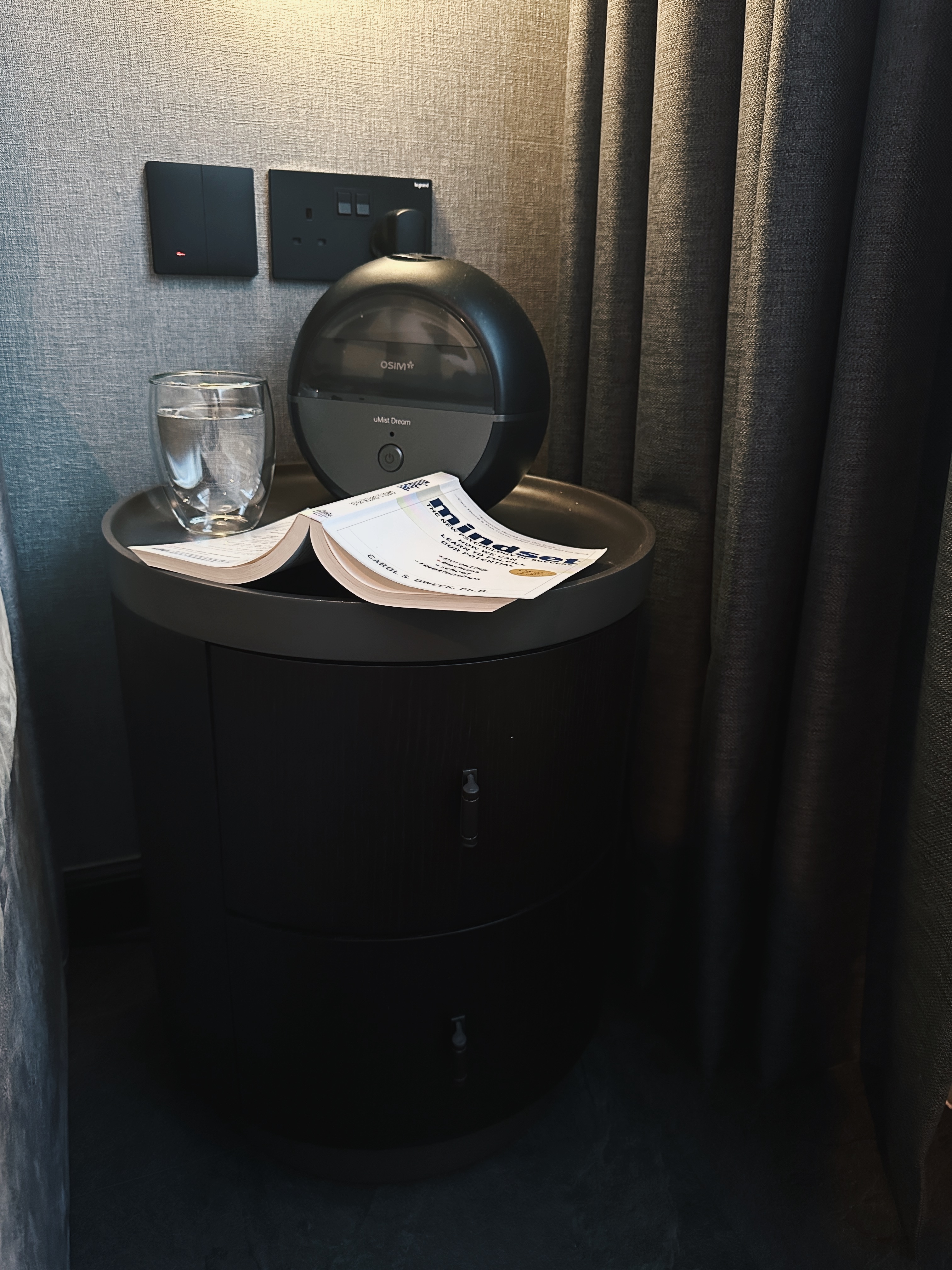 Finding Comfort: A Glimpse into Our Cozy and Minimalist Bedroom - smart home device, modern decor, bedside table, glass of