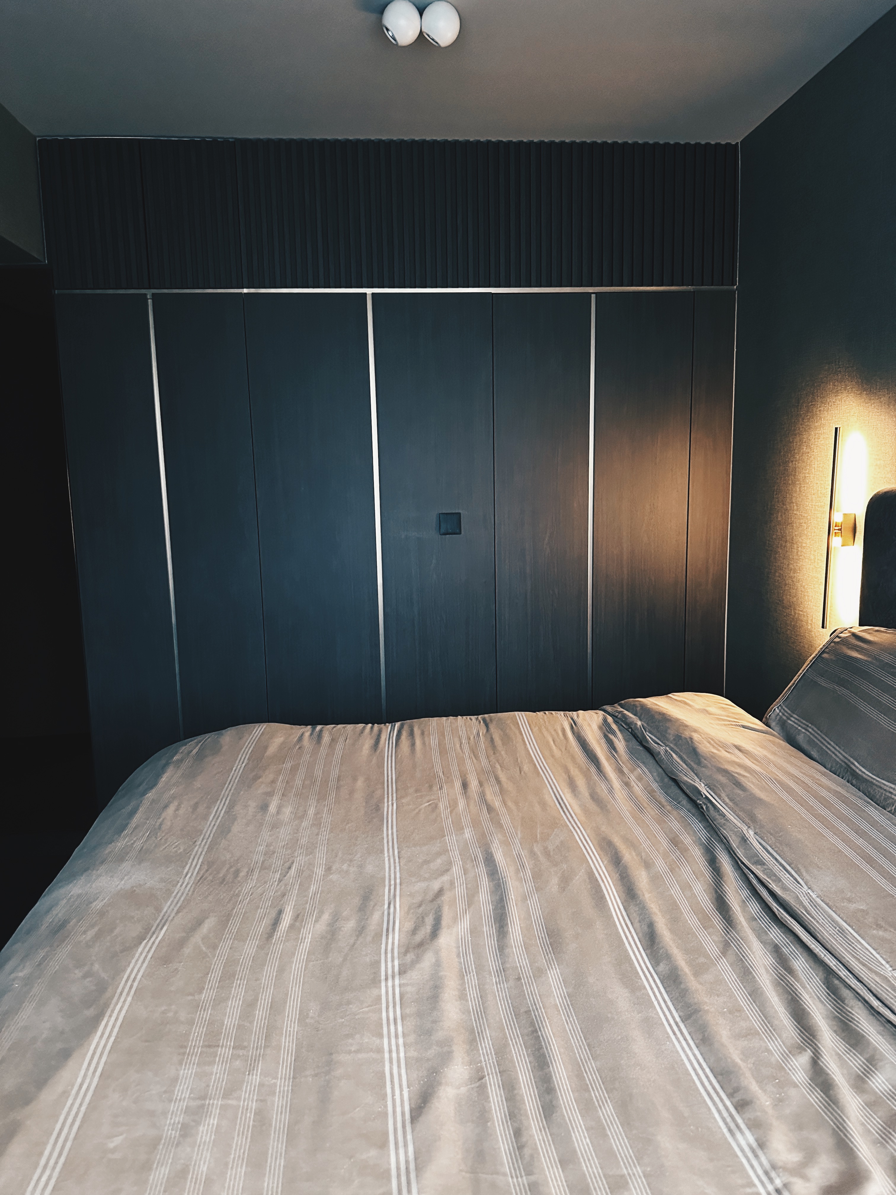Finding Comfort: A Glimpse into Our Cozy and Minimalist Bedroom - Dark, modern bedroom, minimalist design, large bed, beige