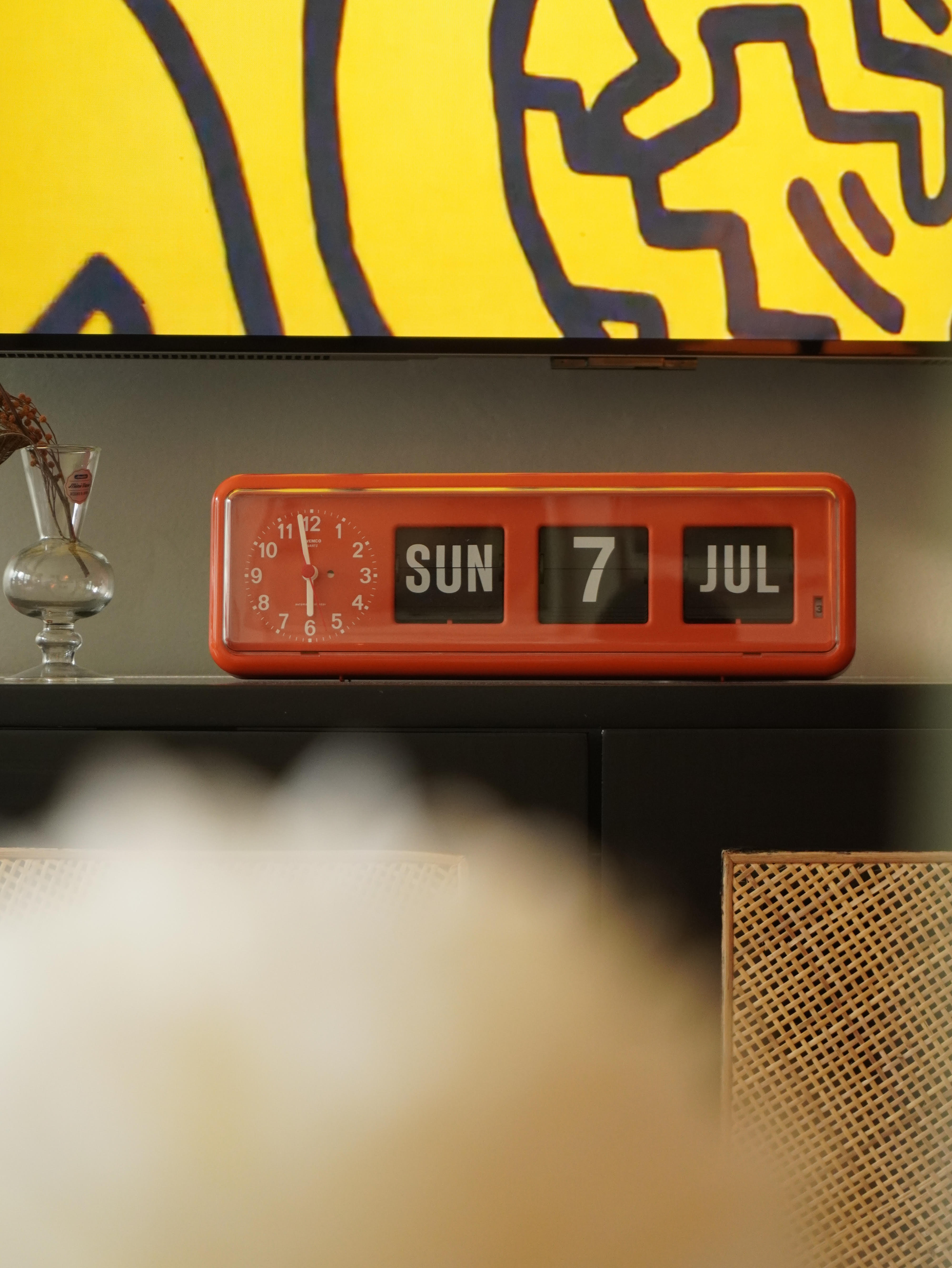 A journey of self-discovery and home renovation journey - Vibrant orange alarm clock displaying Sunday, July 7th, with a