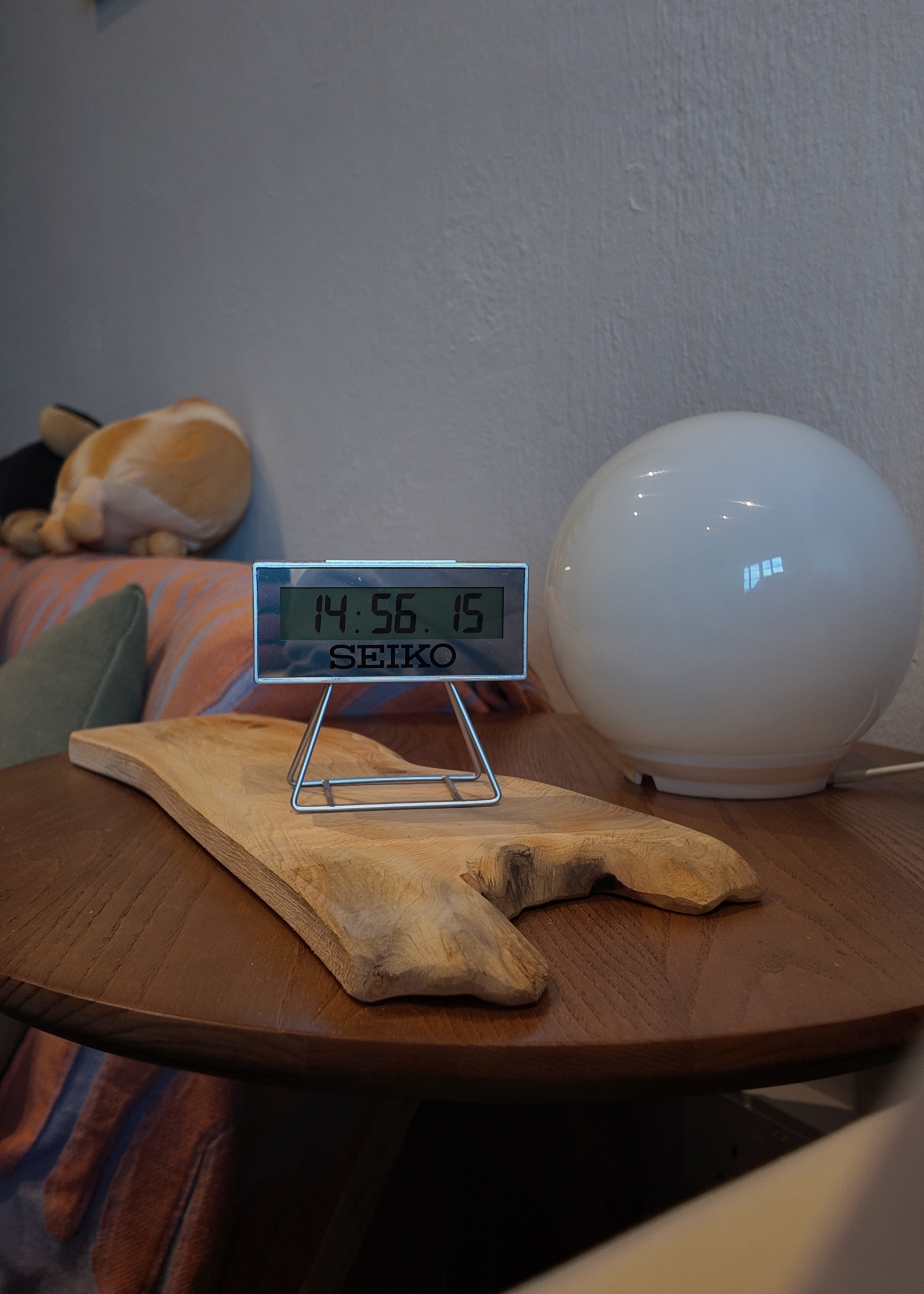 A living room within our bedroom - Seiko digital clock, wooden table, plush toy, white spherical lamp, cozy room, wooden