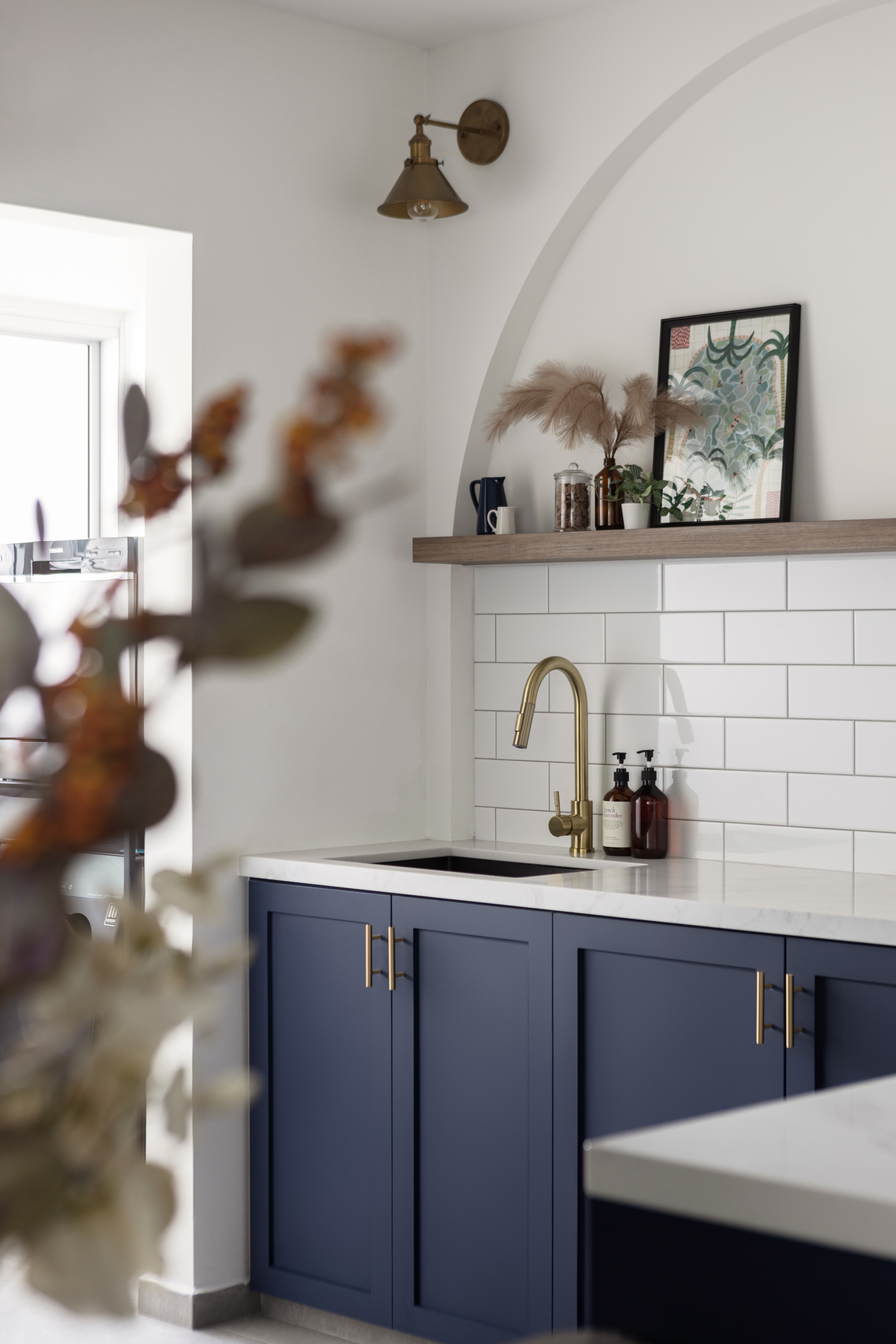 Home decor ideas - we change them from time to time! - Modern kitchen with white tiled backsplash, navy blue cabinets with