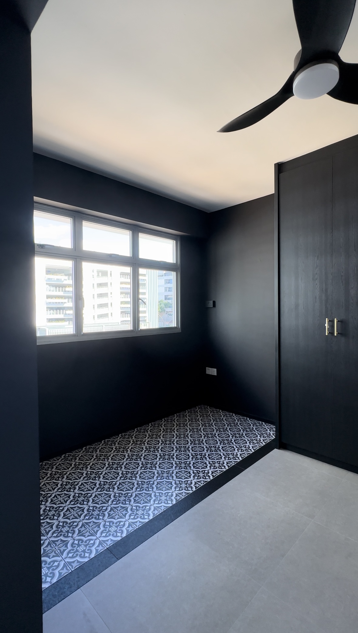 Home decor ideas - we change them from time to time! - Dark gray walls, modern ceiling fan, large window, urban cityscape