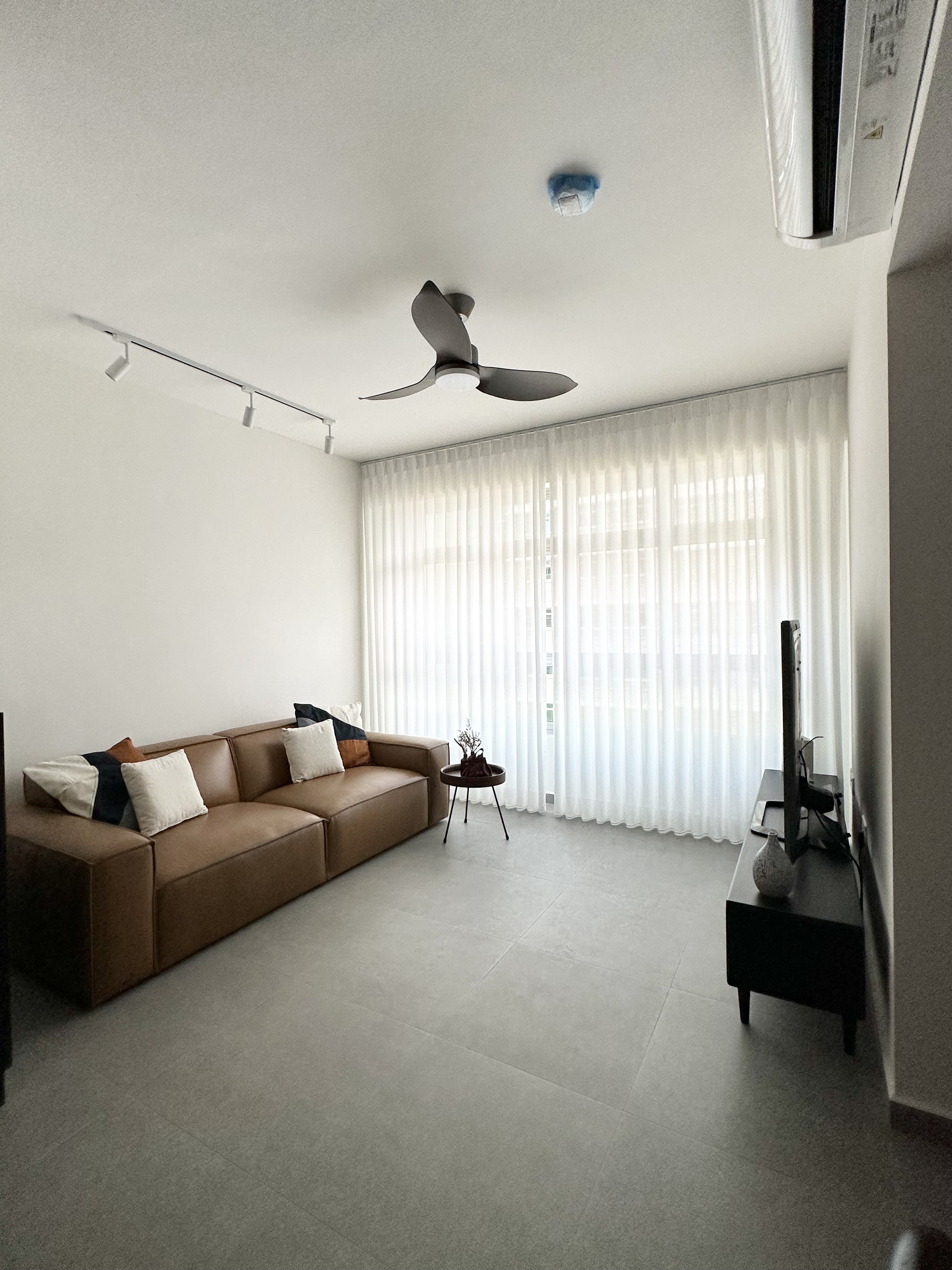 Home decor ideas - we change them from time to time! - Modern minimalist living room with sleek brown leather sofa, large