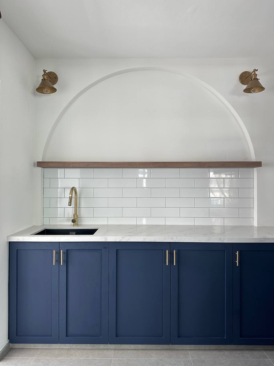 Home decor ideas - we change them from time to time! - White tiled backsplash, gold faucet, navy blue cabinets, marble
