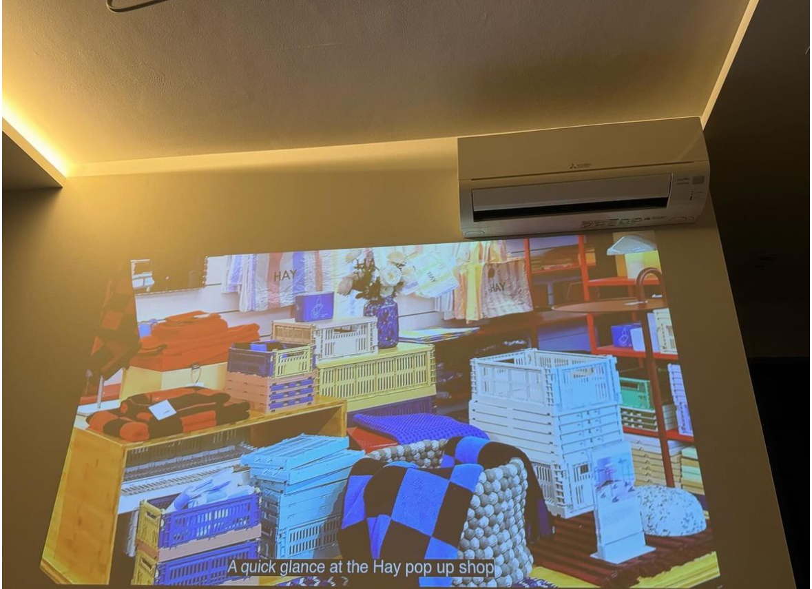 Lights, Cameras, Flash: Warm Lights All The Way in a 4Room BTO - Hay pop-up shop, vibrant displays, colorful crates, neatly