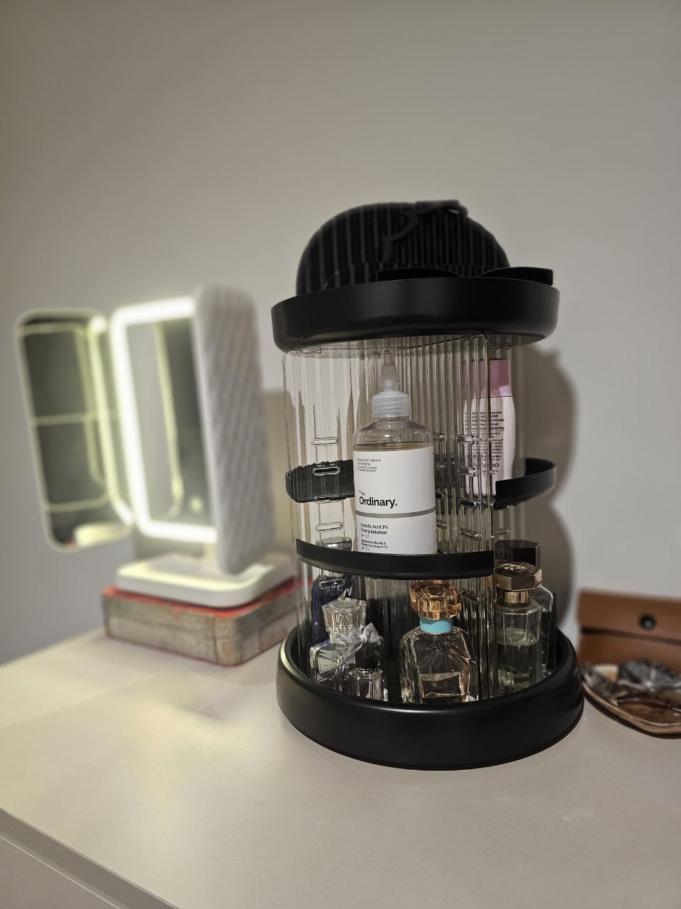 Simple living - prioritizing function and convenience in our bedroom - Organized vanity set, sleek black container, skincare