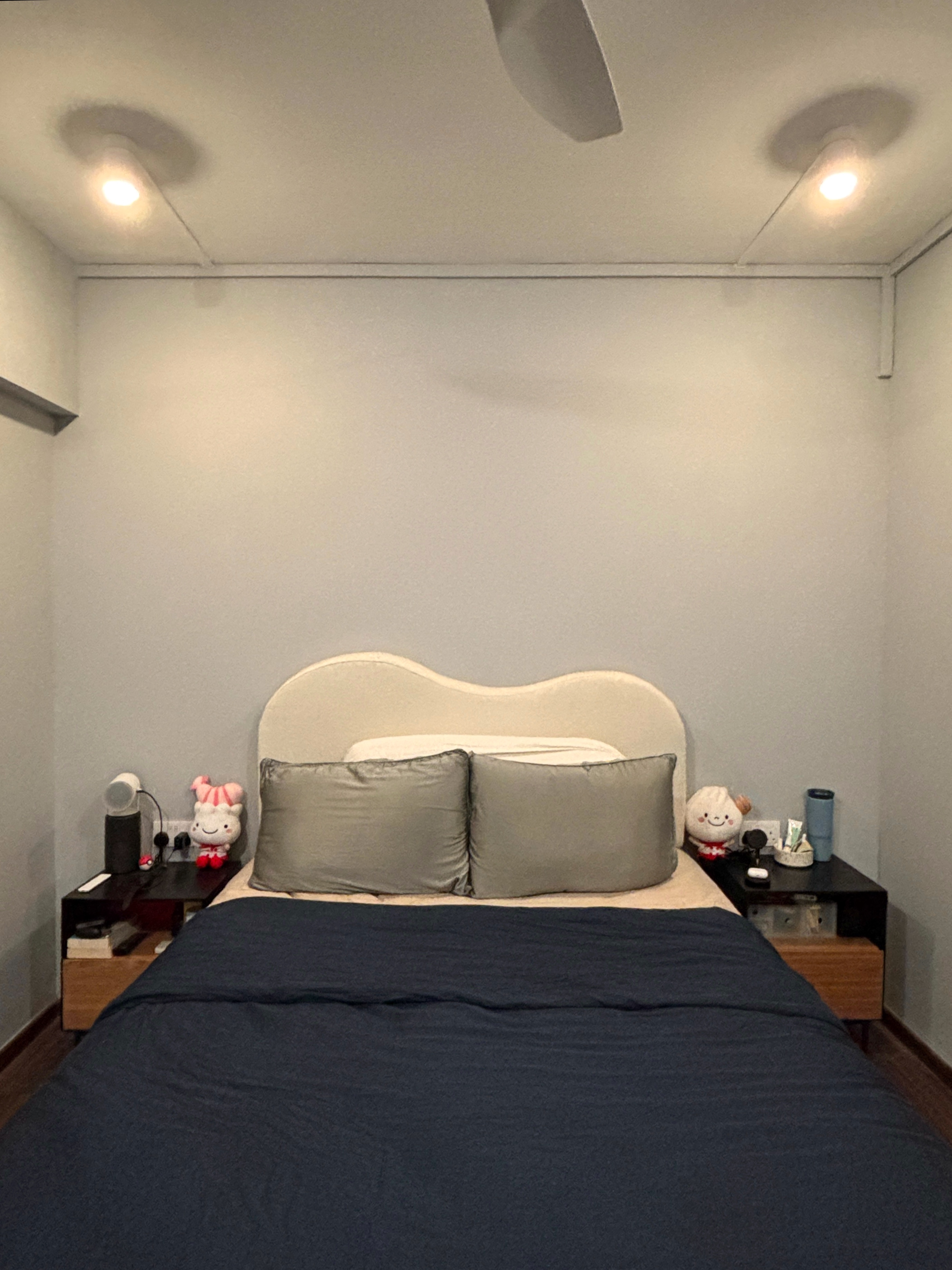 Transforming Our Bedroom from Minimal to Cosy  - modern bedroom, cozy bed, white headboard, gray pillows, dark blue bedding