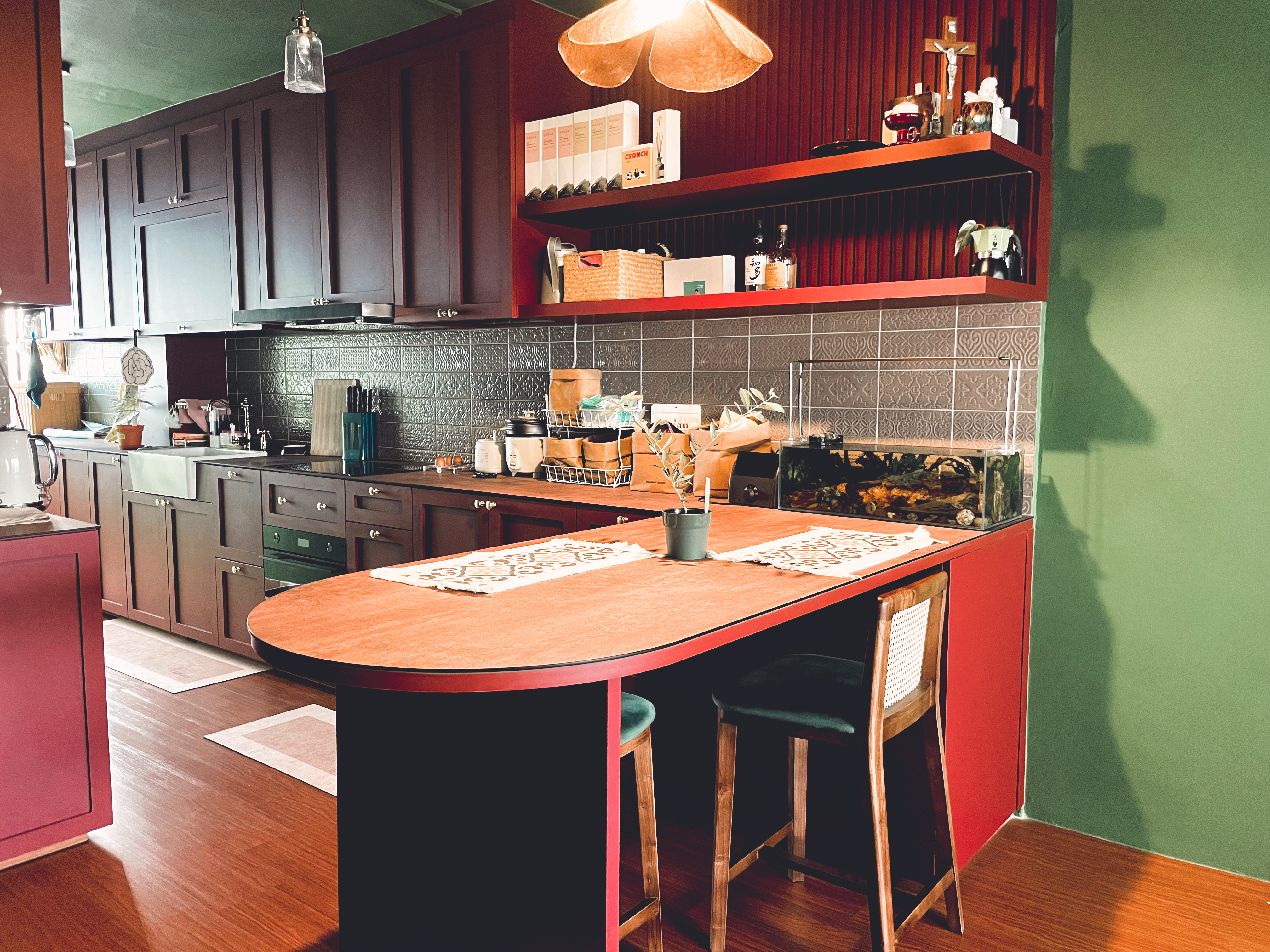 Peninsula: Versatile Dining Area for Every Occasion - Modern kitchen with dark brown cabinets, red backsplash, and green