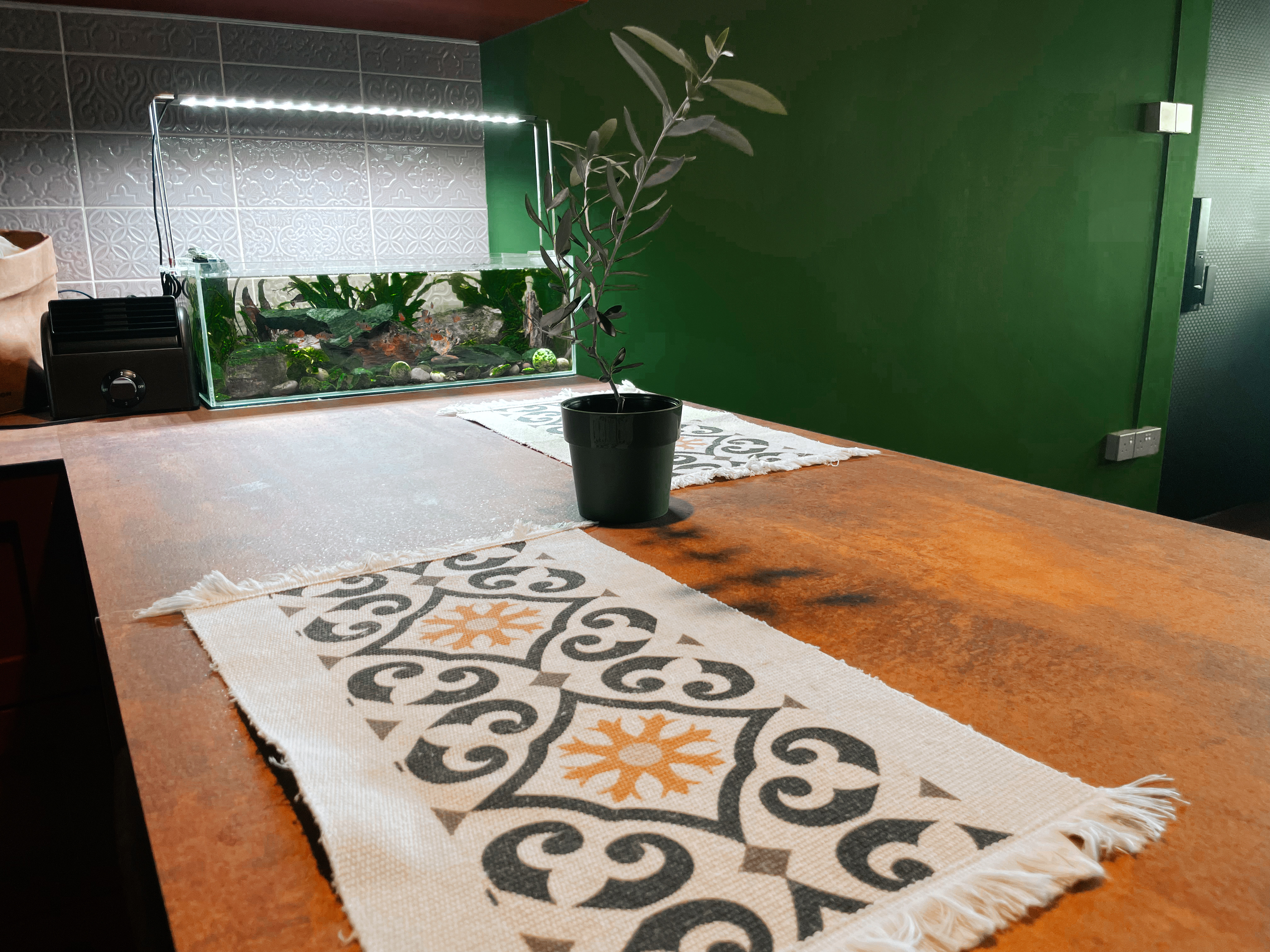 Peninsula: Versatile Dining Area for Every Occasion - Green wall, indoor setting, modern decor, aquarium, indoor plants