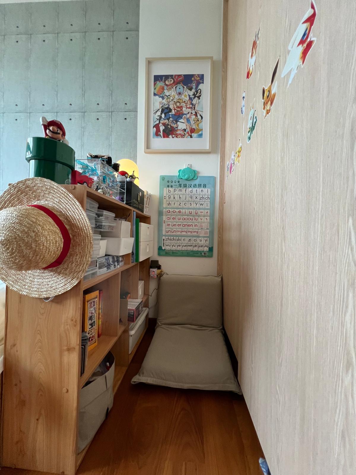 "Masking Tape Magic : Refresh Kid's Room with Style!" - Wooden shelf, straw hat, beige cushion, calendar, colorful stickers
