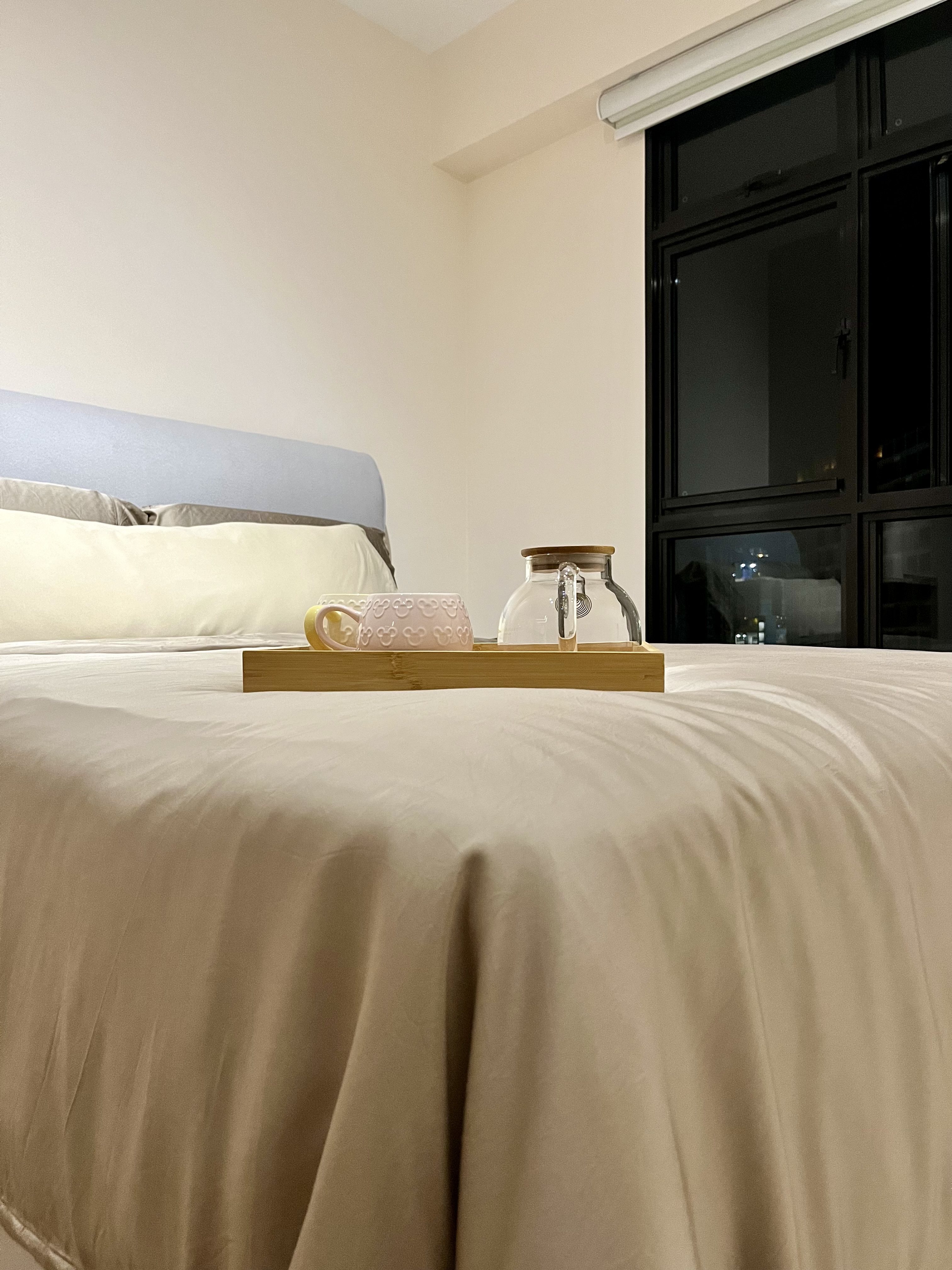 Master Bedroom: Going Basic with a Near Monochromatic Look - Soft beige bedding, minimalist design, bedside table, wooden