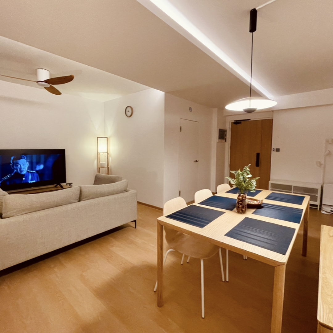 42k Reno for a 4 room resale flat in Punggol  - Modern living room with beige sofa, wooden dining table with blue placemats