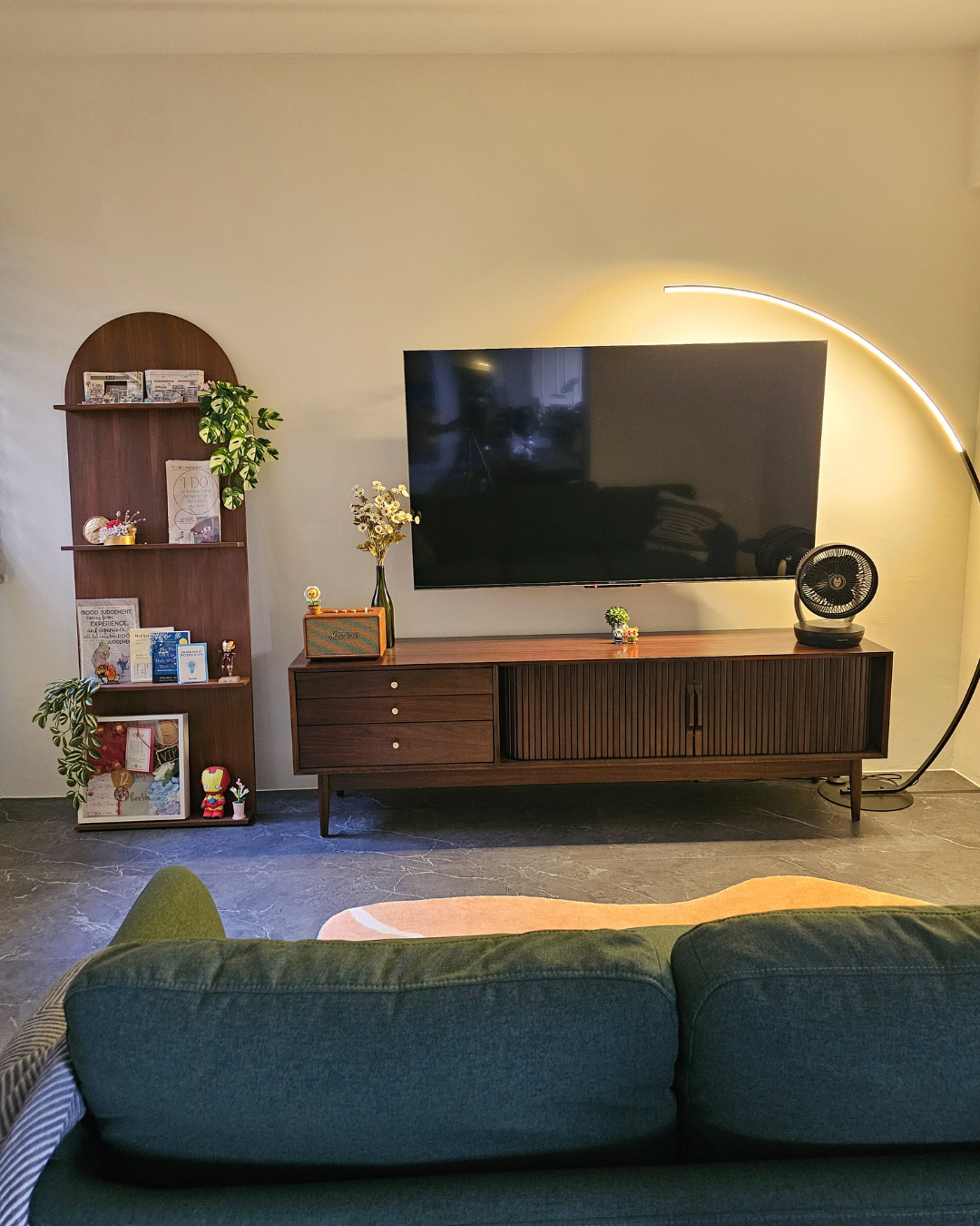 Cozy Up for Movie Nights: The Charm of Full-Height Glass Doors - Wooden shelf, books, plants, decorative items, TV stand