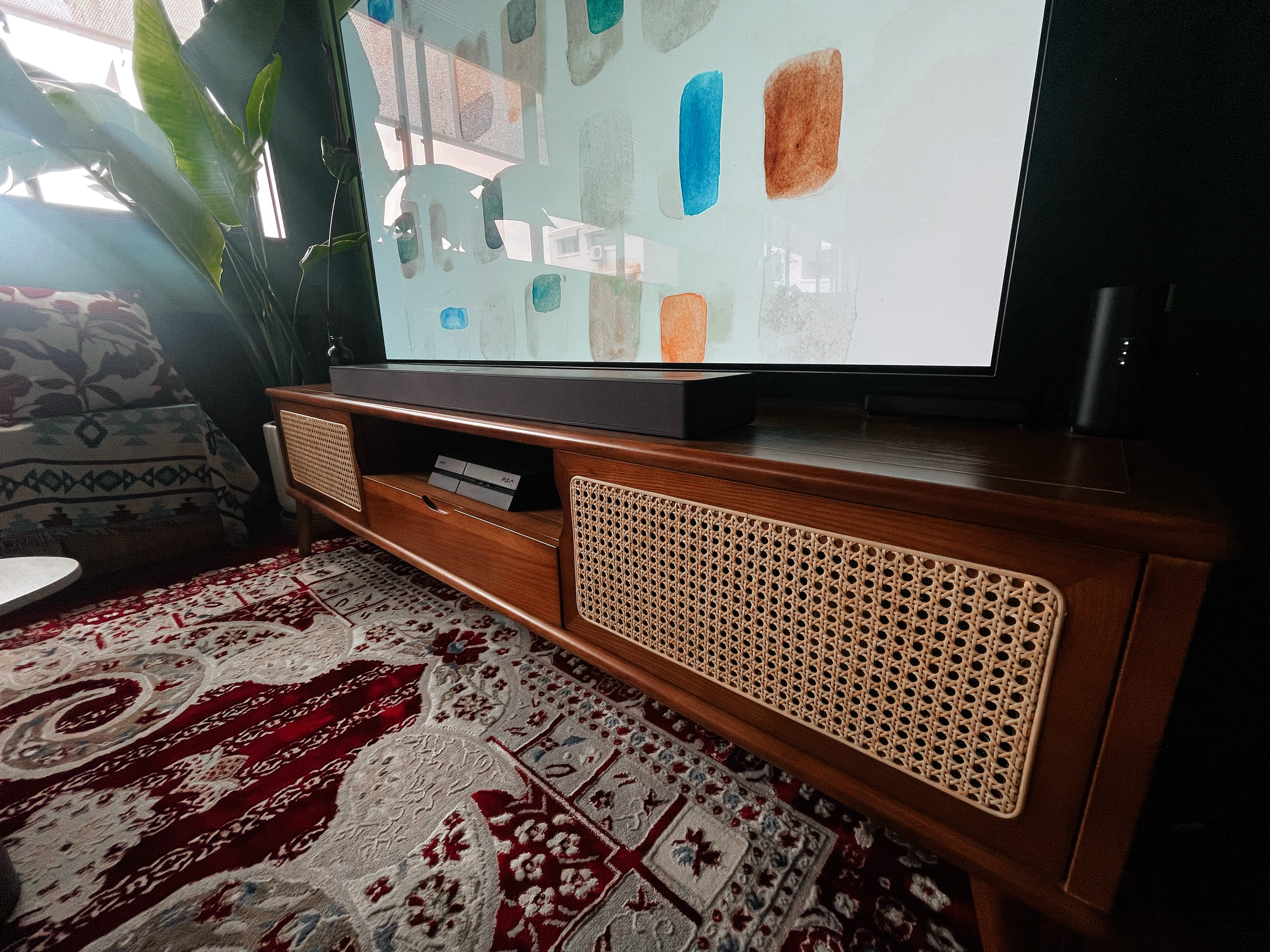 Curated Mix & Match: Our Living Room's Perfect Blend - Large modern TV, colorful abstract artwork, cozy living room