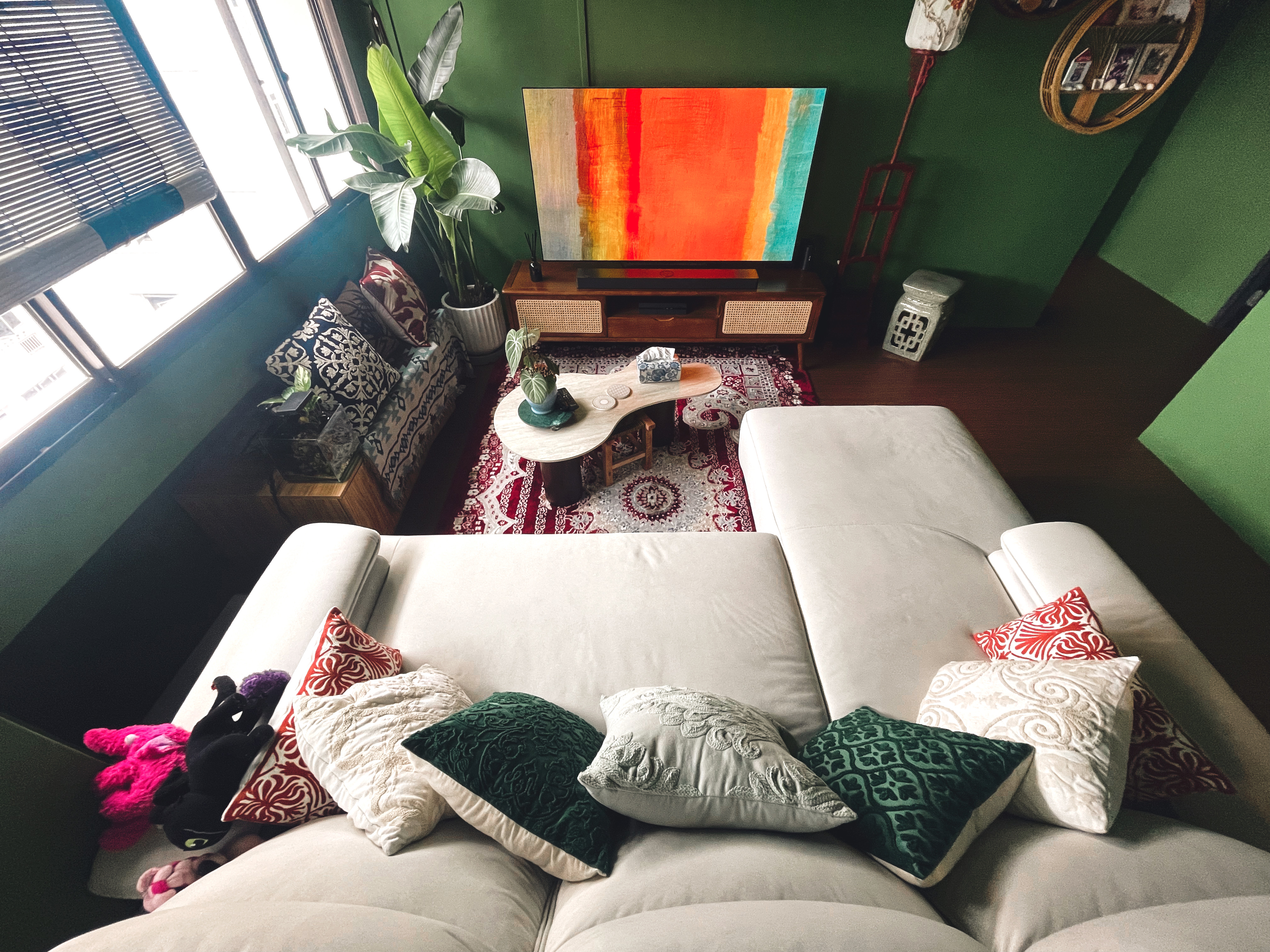 Curated Mix & Match: Our Living Room's Perfect Blend - Green wall, cozy living room, large window, indoor plants, abstract