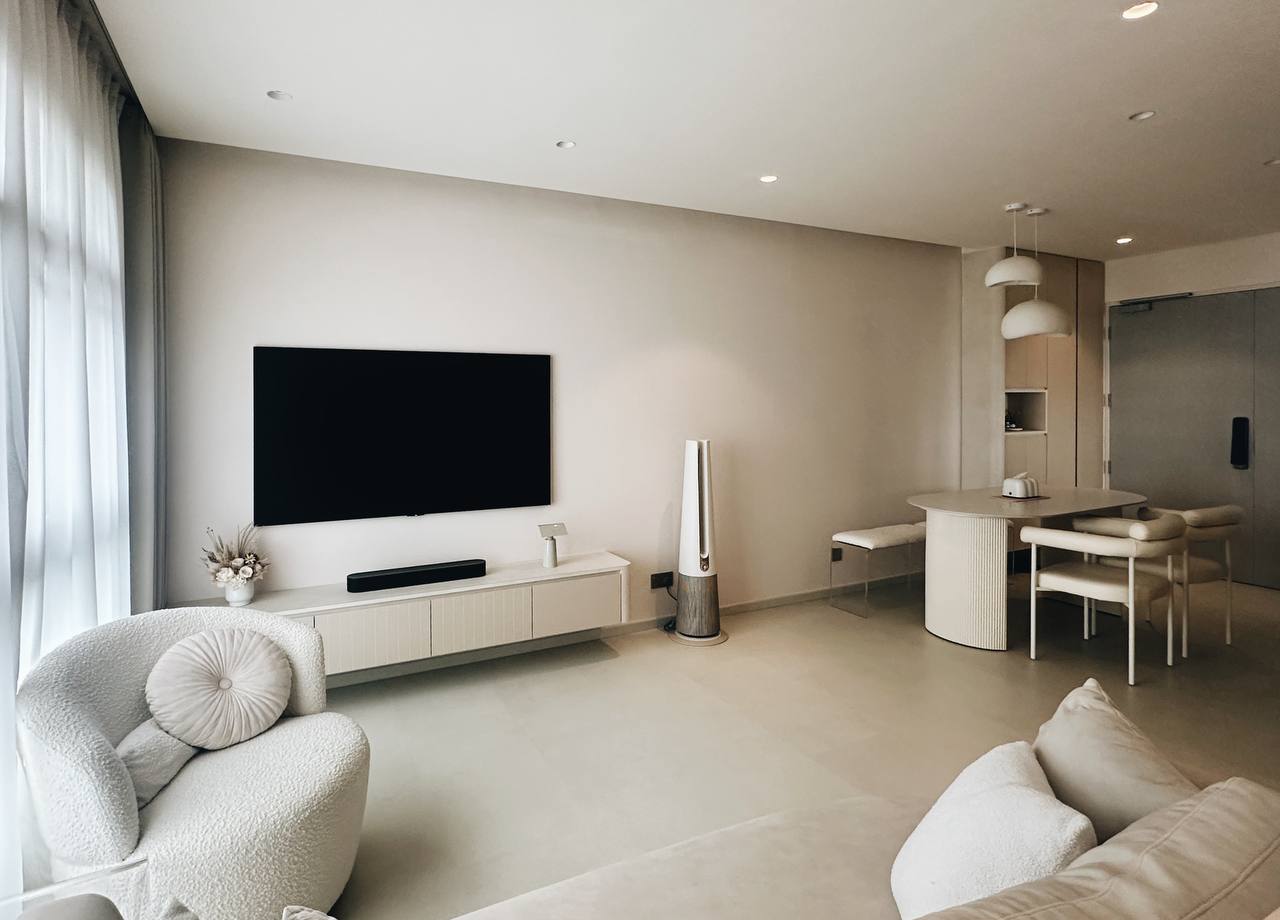 Our Living Room - Modern Minimalist's Dream - Modern minimalist living room with sleek furniture, large flat-screen TV