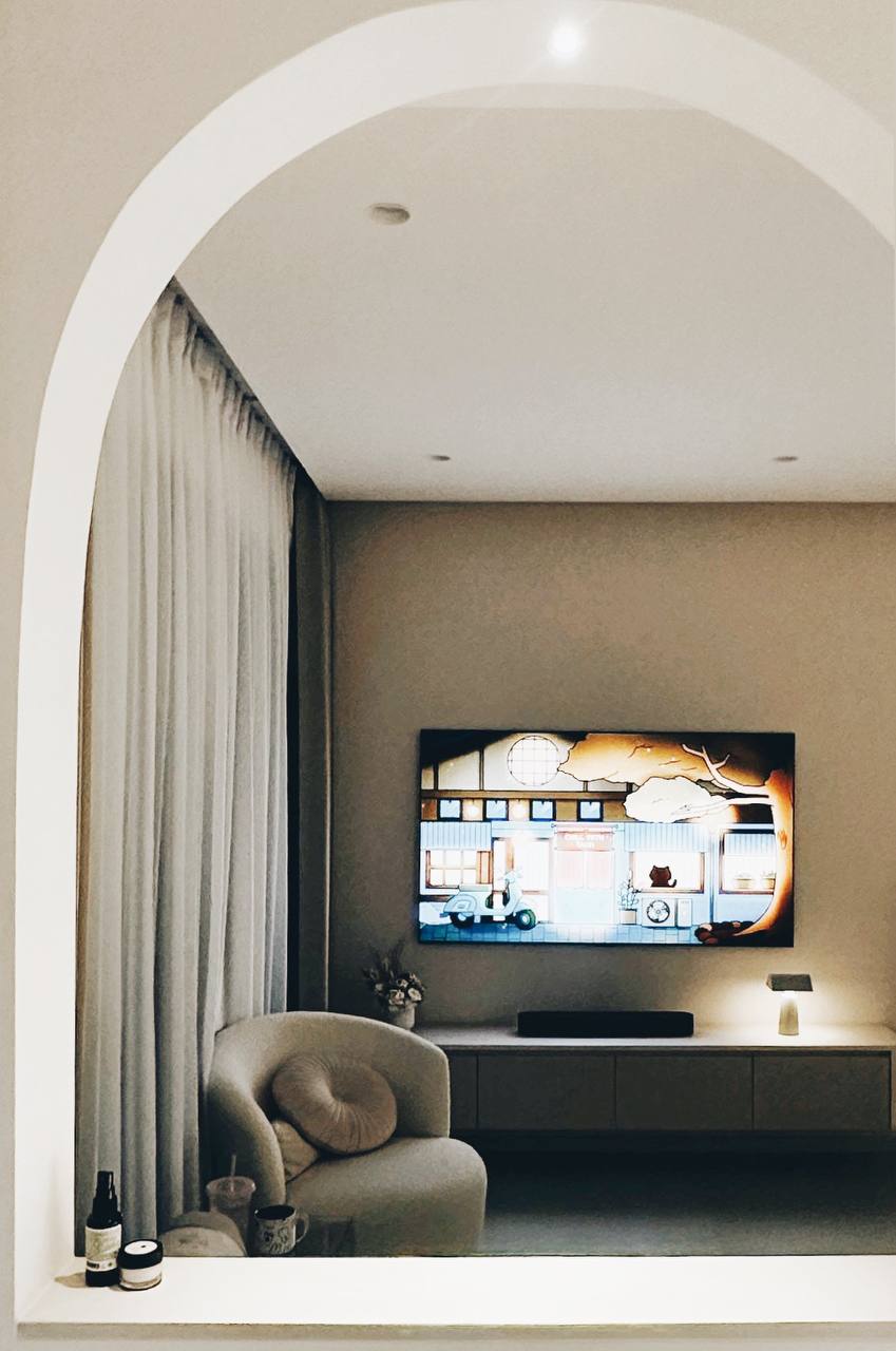 Our Living Room - Modern Minimalist's Dream - Arched doorway, modern living room, minimalist decor, soft lighting, cozy