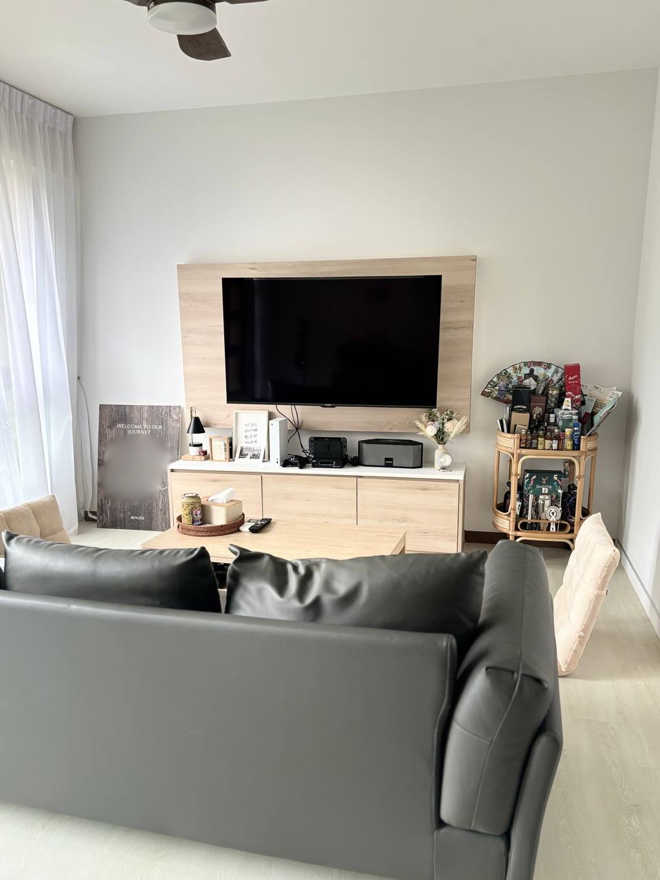 From Day to Night: Japandi Living Space With Collectables - Modern living room, minimalist decor, large flat-screen TV