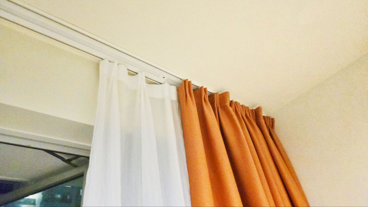 Transforming Our Living Room : Minimalist and Smart Storage Solution - Orange curtains, sheer white curtain, window with