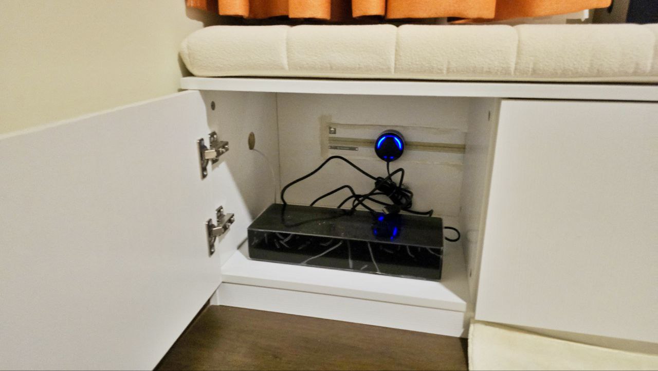 Transforming Our Living Room : Minimalist and Smart Storage Solution - Underneath the soft, white cabinet, a sleek black