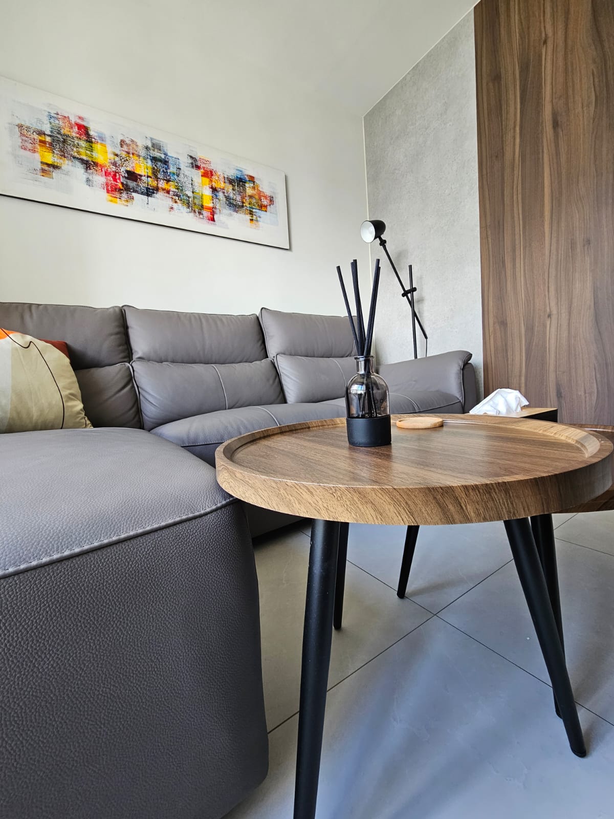 Fluted Texture in a Bright Living Space - Modern living room, contemporary furniture, gray sectional sofa, abstract painting