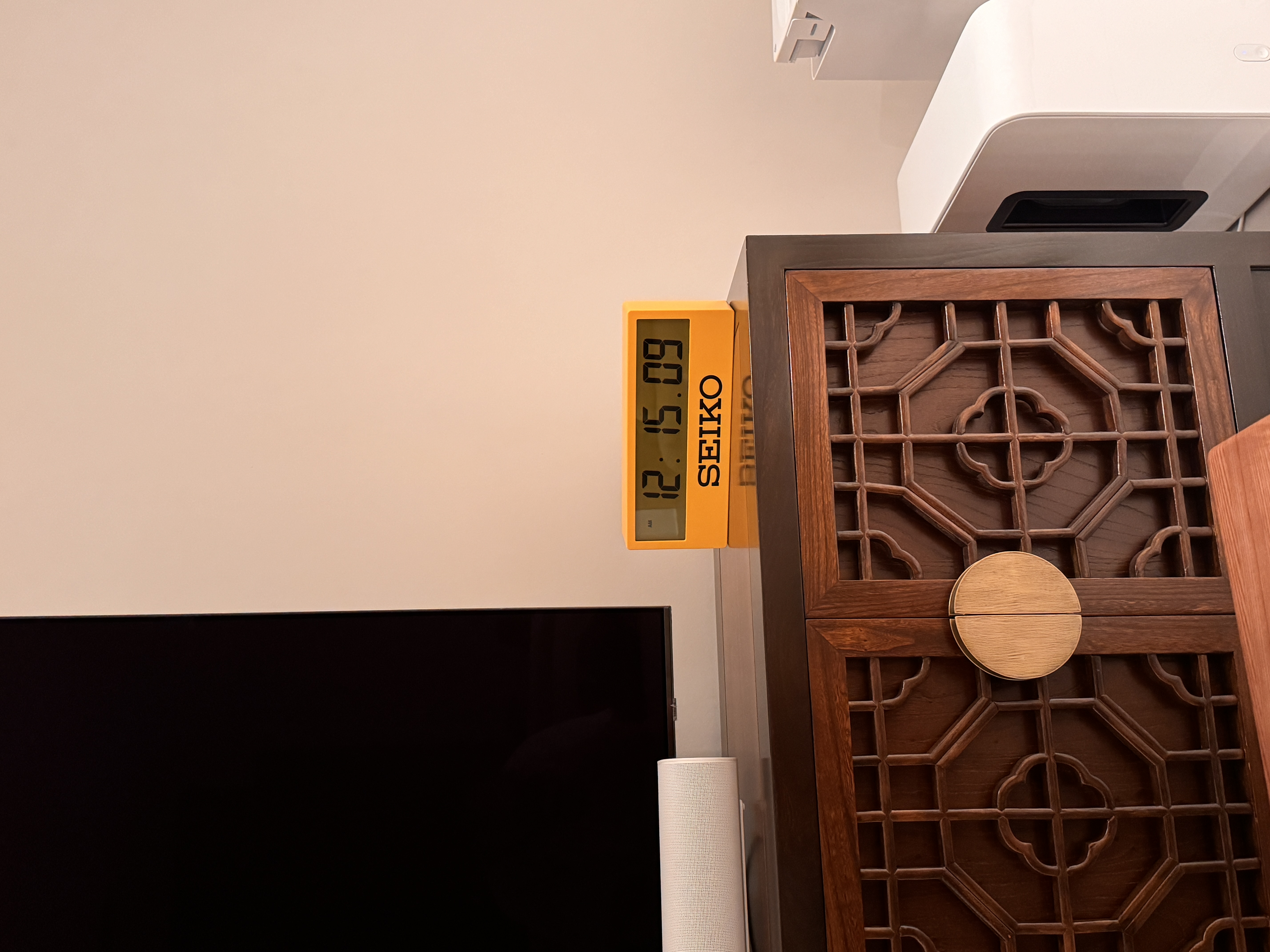 Adding ✨ Character ✨ to our living room 🤪 - Seiko digital clock, 12:09, wall-mounted, wooden cabinet, intricate design