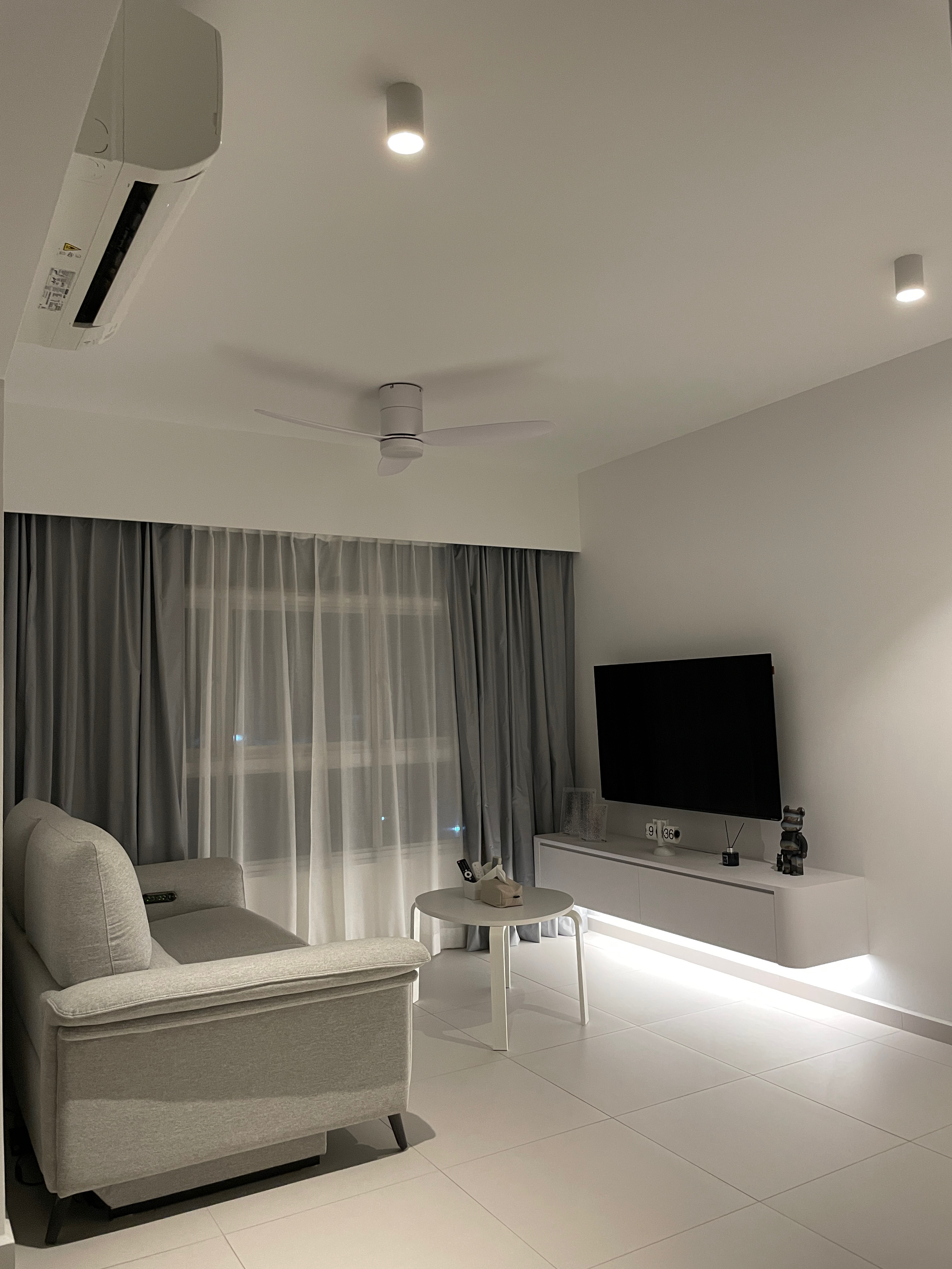 A Minimalist White & Grey Living Room: Heart Of Our Home ✨ - Modern minimalist living room, sleek gray sofa, floor-to-ceiling