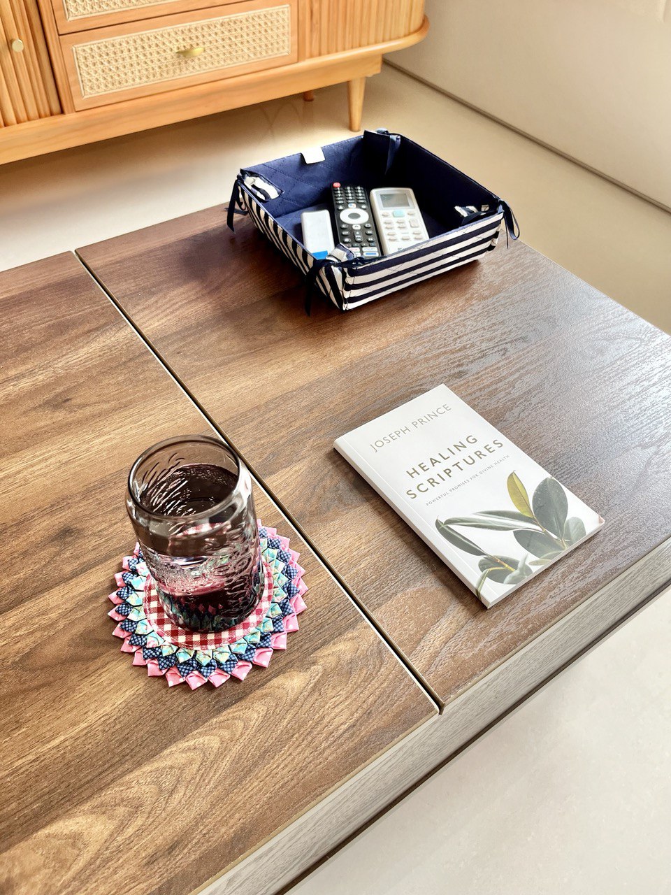 Living Room: Ritz Carlton Inspired Space With Settee in a 3-Room BTO - Wooden coffee table, glass with dark liquid, coaster
