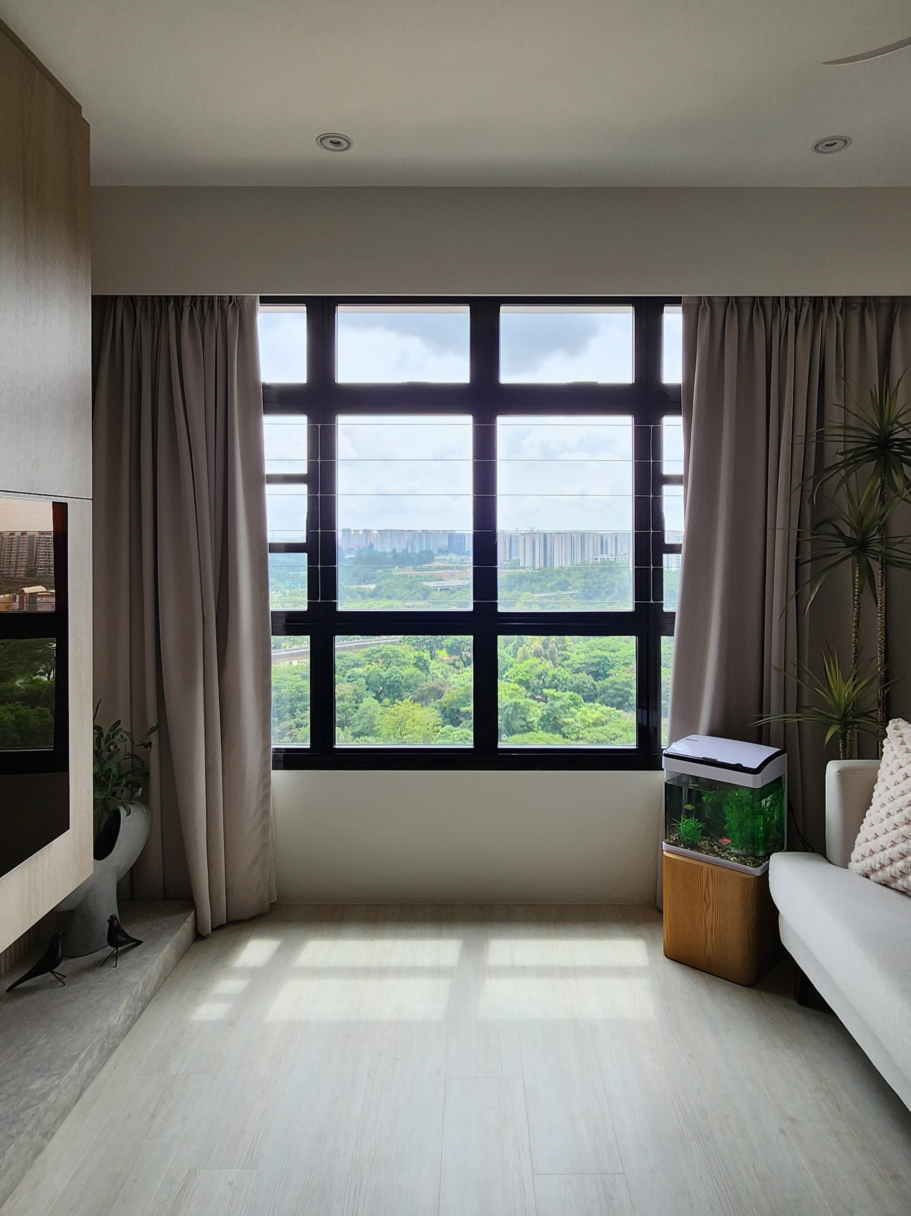 Our Living Area: A Reflection Of Our Innerselves  - Large window, cityscape, greenery, indoor plants, modern decor, light