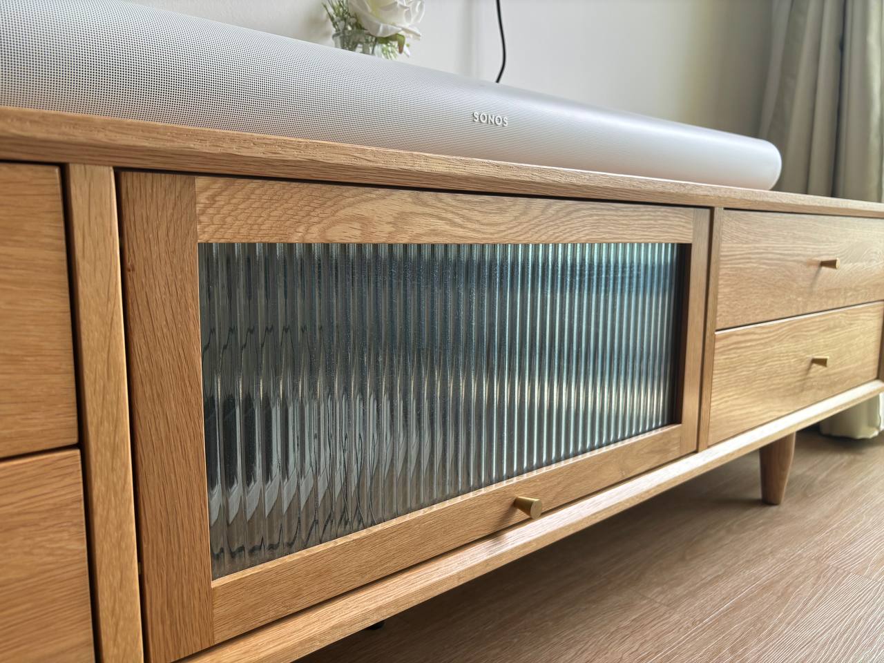 Our Living Room: When Curves and Green meet - Wooden TV cabinet, modern design, sleek finish, wooden texture, light wood