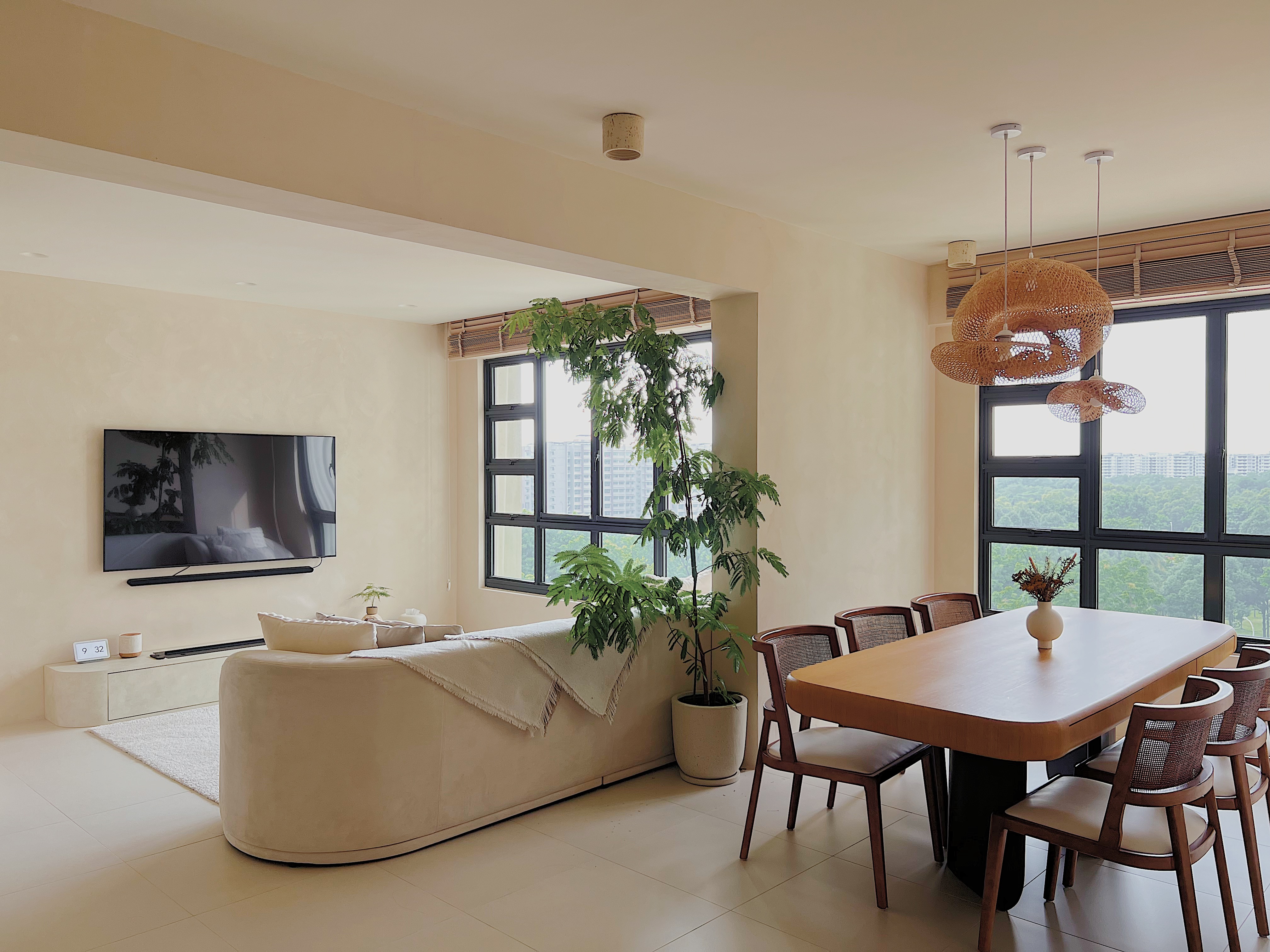 Unwind in our Creamy Limewashed Living Room! - Modern living room with beige walls, large window, indoor plant, contemporary