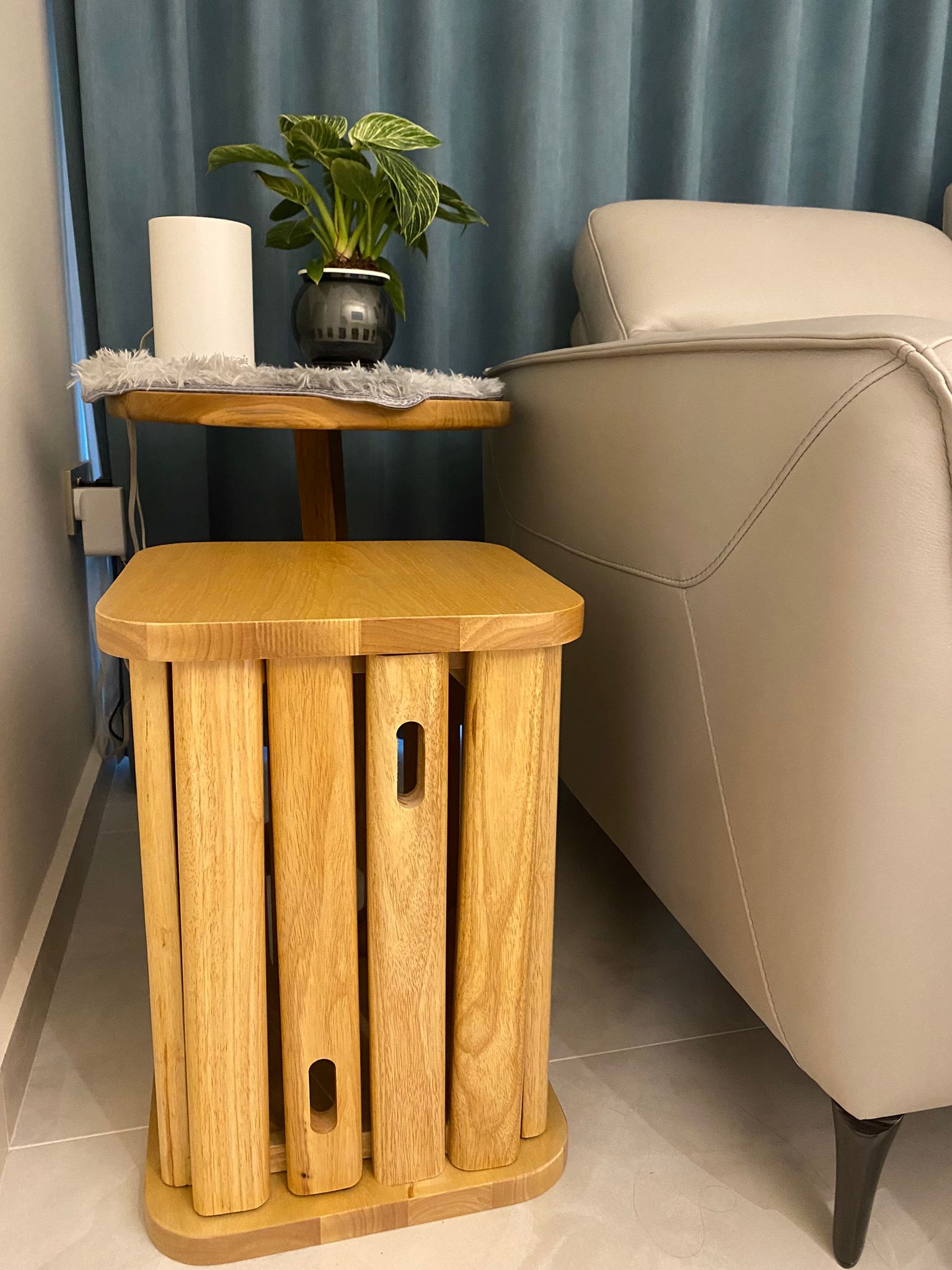 Zero built-in cozy living room with Greeneries - Wooden side table, beige leather chair, soft blue curtain, green potted