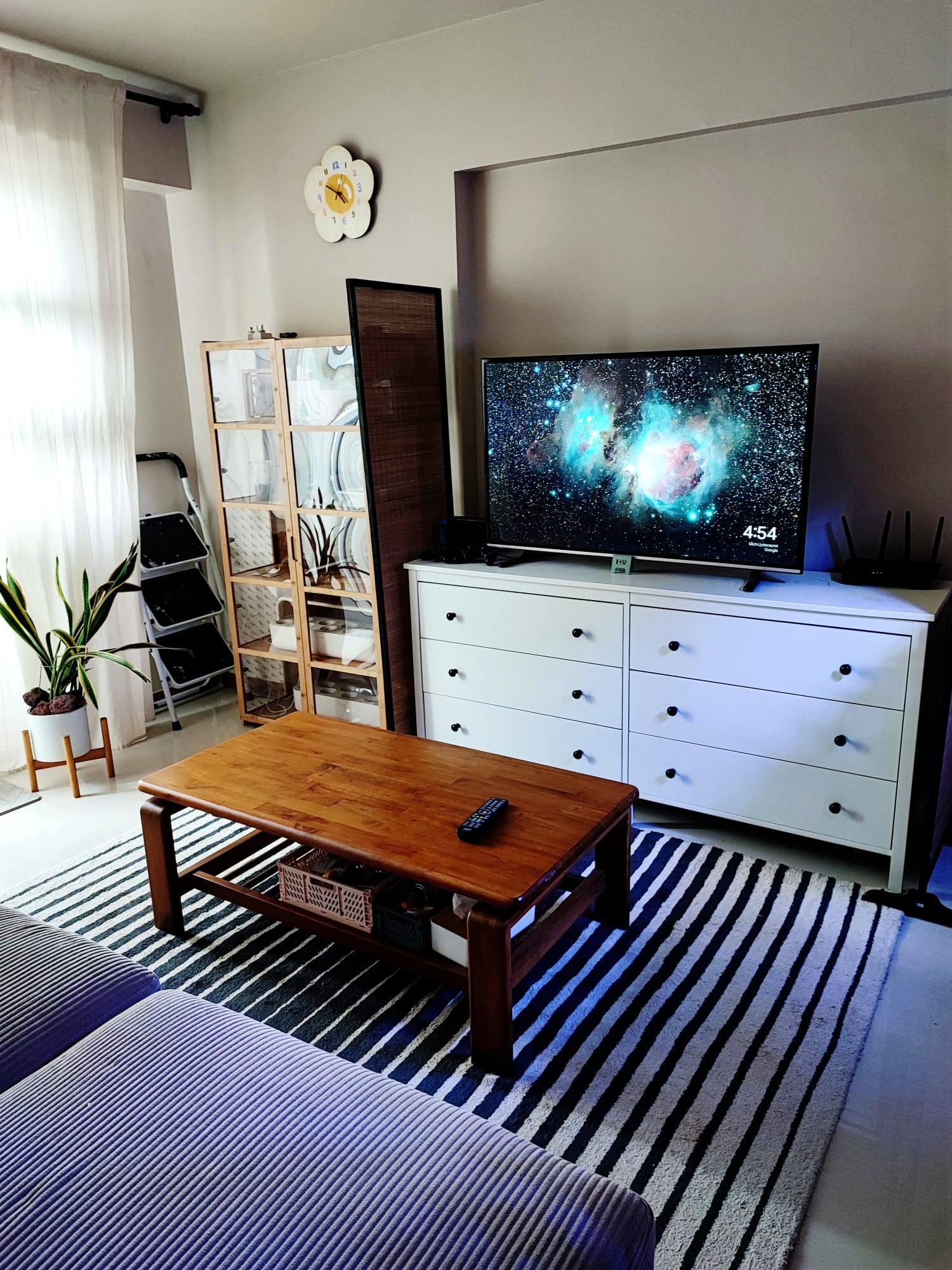 Purrfect Harmony: A living room for cats and their humans - Living room, modern decor, cozy atmosphere, TV on, starry night