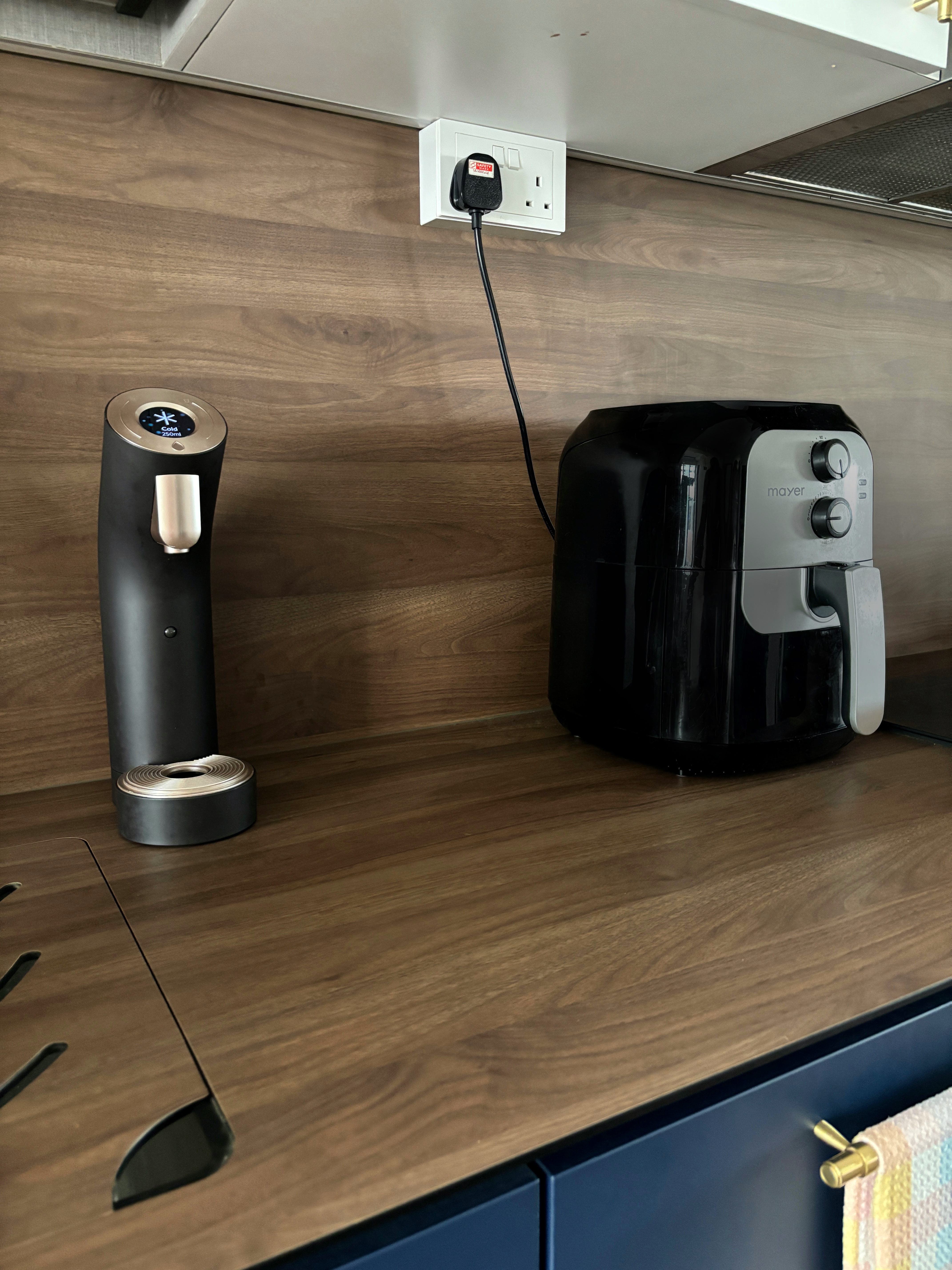 Our Best Home Investment for Staying Hydrated - Sleek black and silver toaster with digital display and control buttons