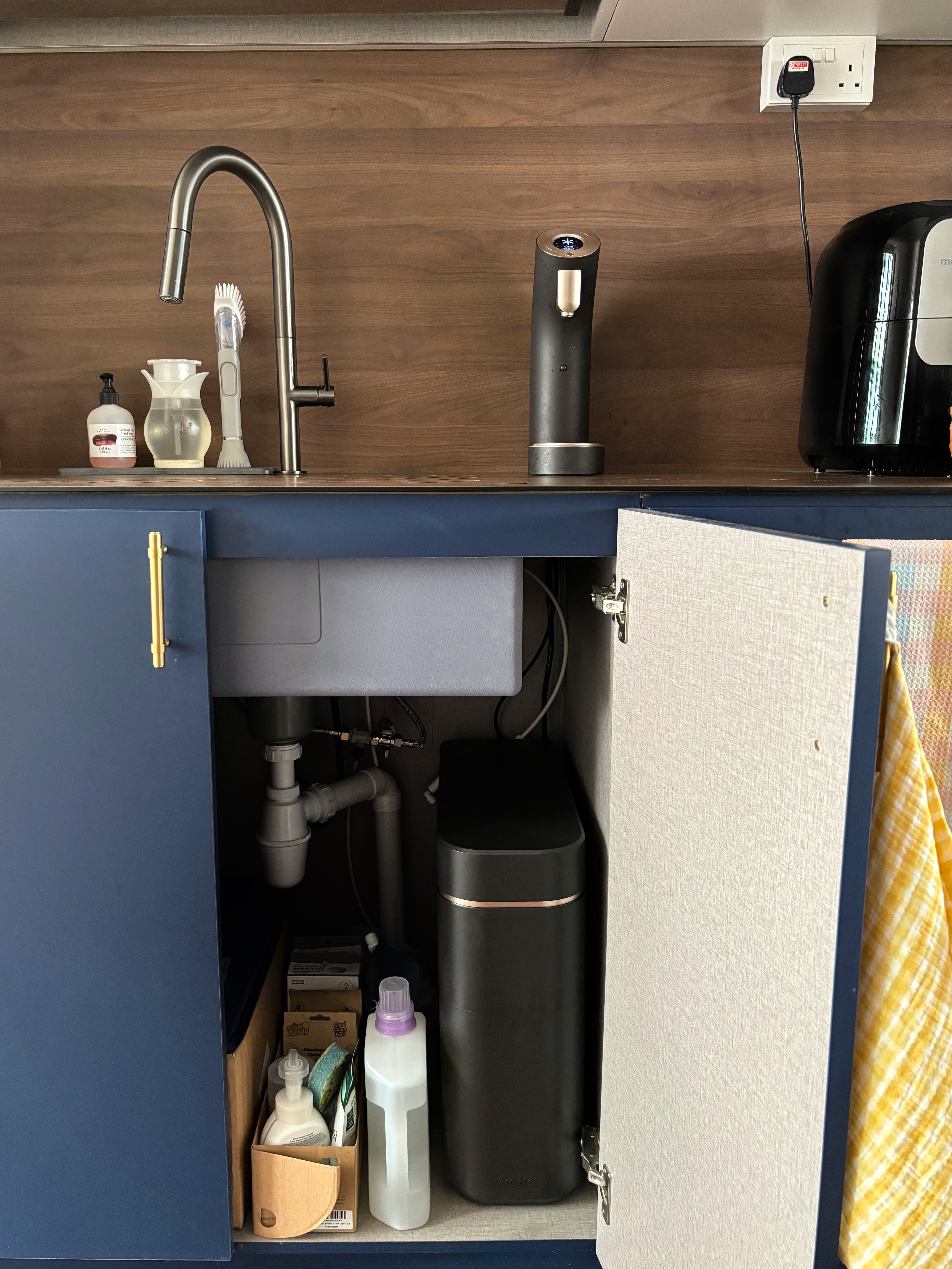 Our Best Home Investment for Staying Hydrated - Under-cabinet sink, modern kitchen, stainless steel faucet, wooden