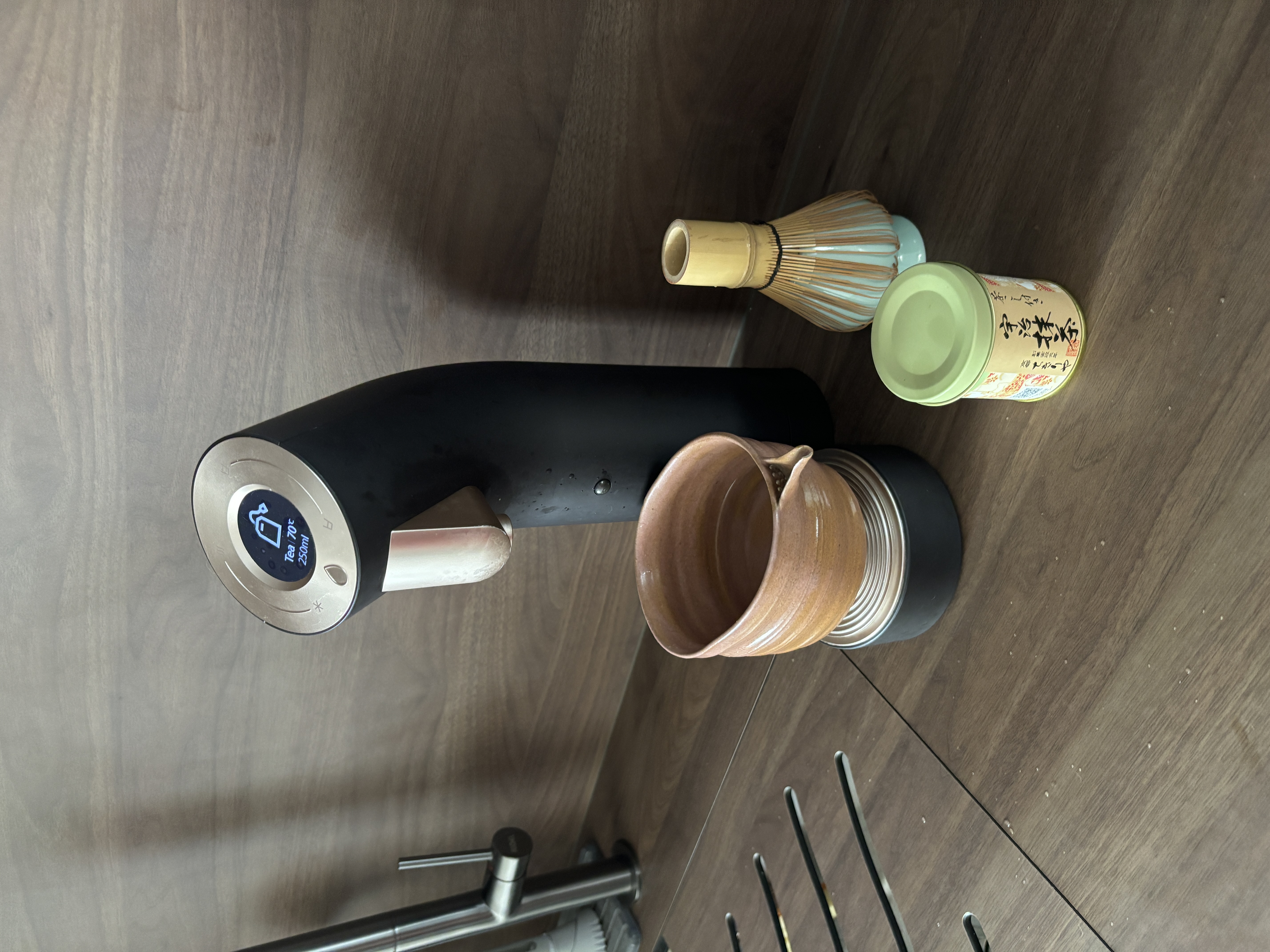 Our Best Home Investment for Staying Hydrated - electric tea kettle, ceramic mug, wooden floor, modern kitchen, tea