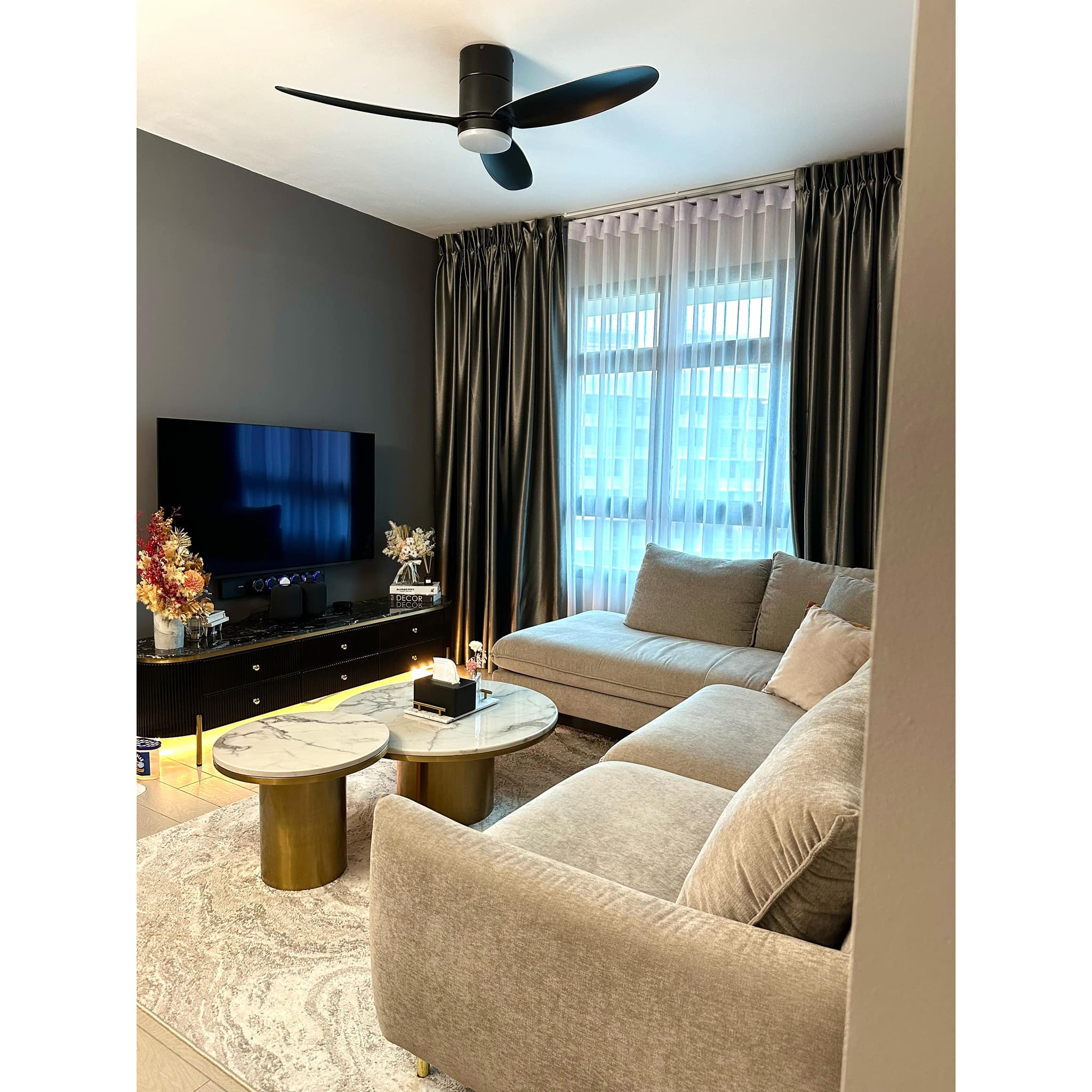 Creating A Modern-luxe Living Room Through Perfect Furniture Pairing - Modern living room with sleek ceiling fan, large