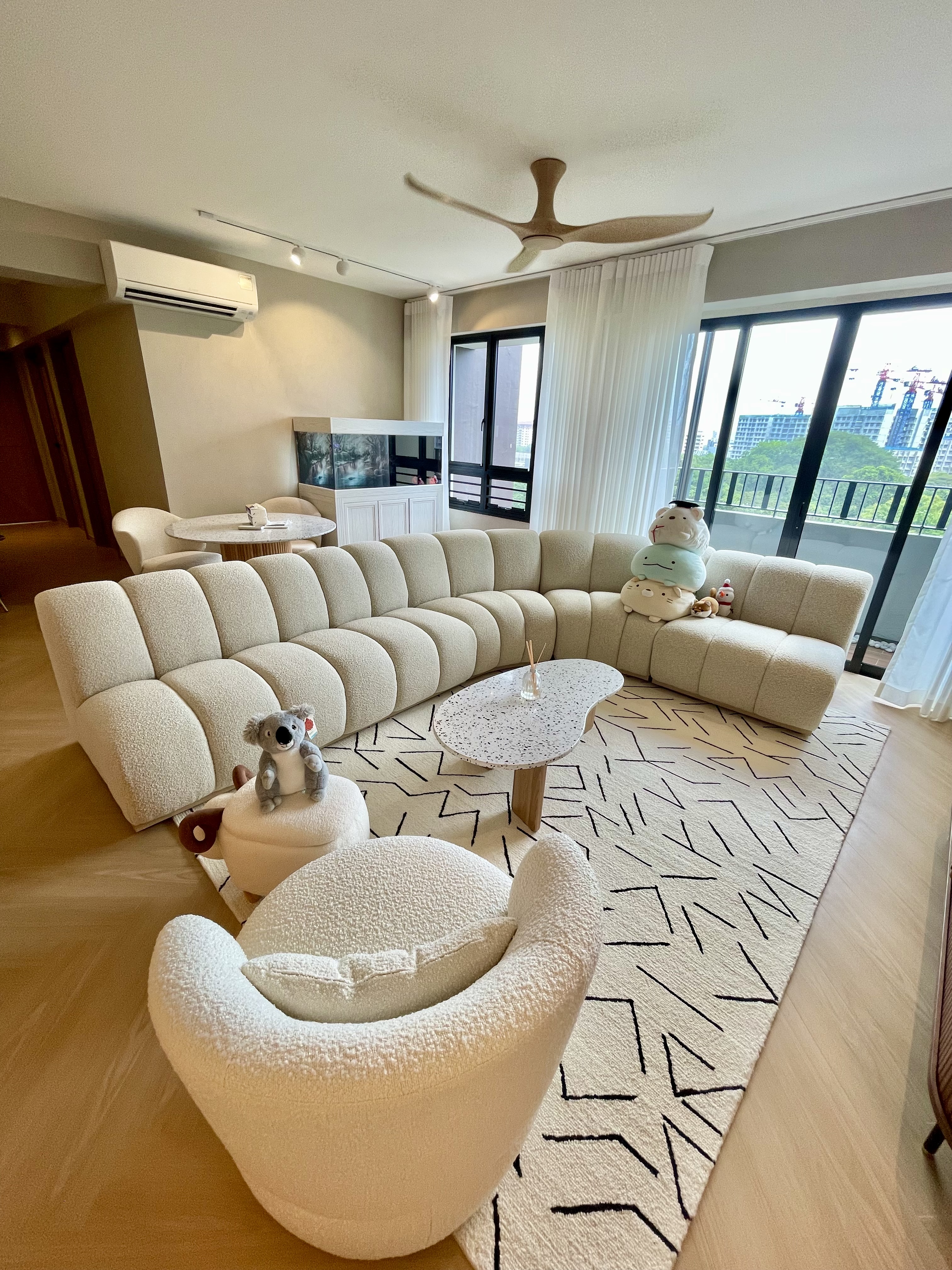 Our Japandi Lounge: A Blend Of Limewash Walls And Curved Fluted Panels - Modern living room with beige tufted sofa, plush