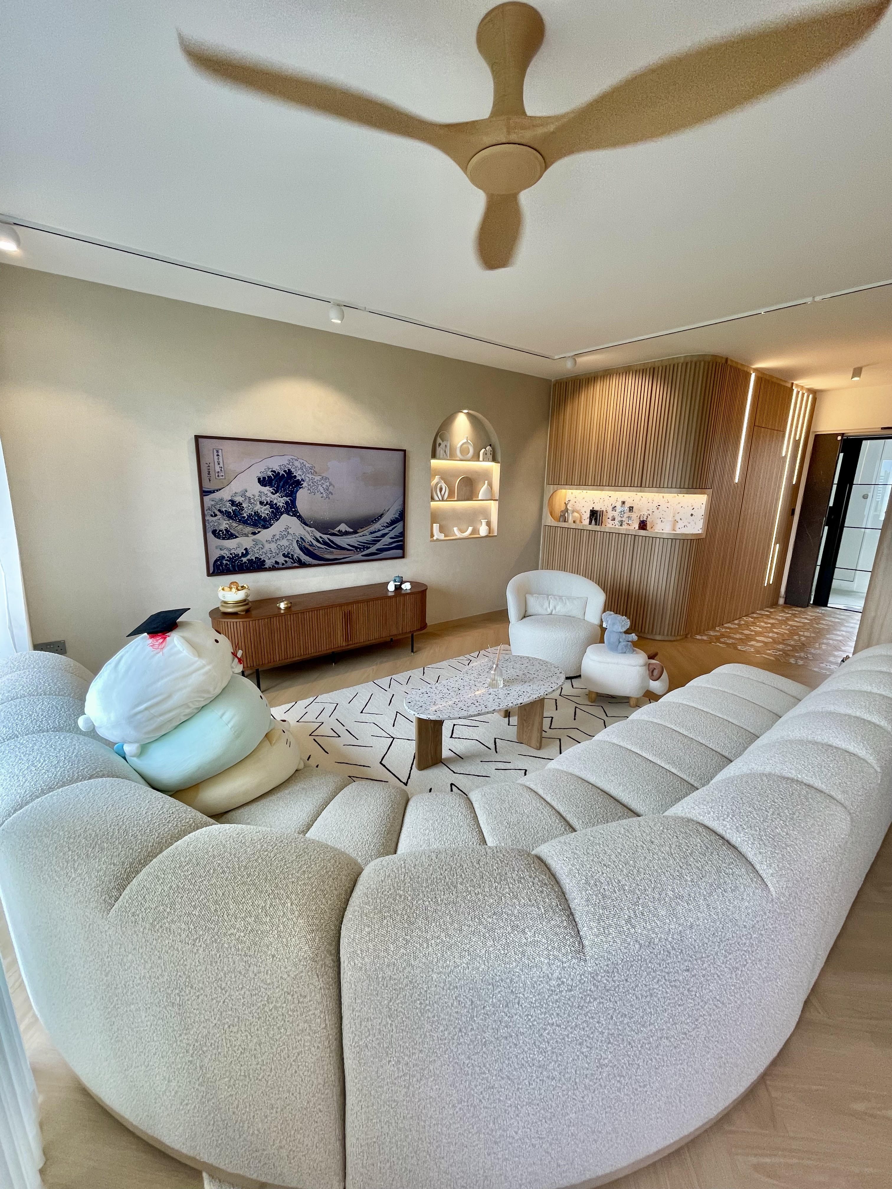 Our Japandi Lounge: A Blend Of Limewash Walls And Curved Fluted Panels - Modern living room with plush beige sectional sofa