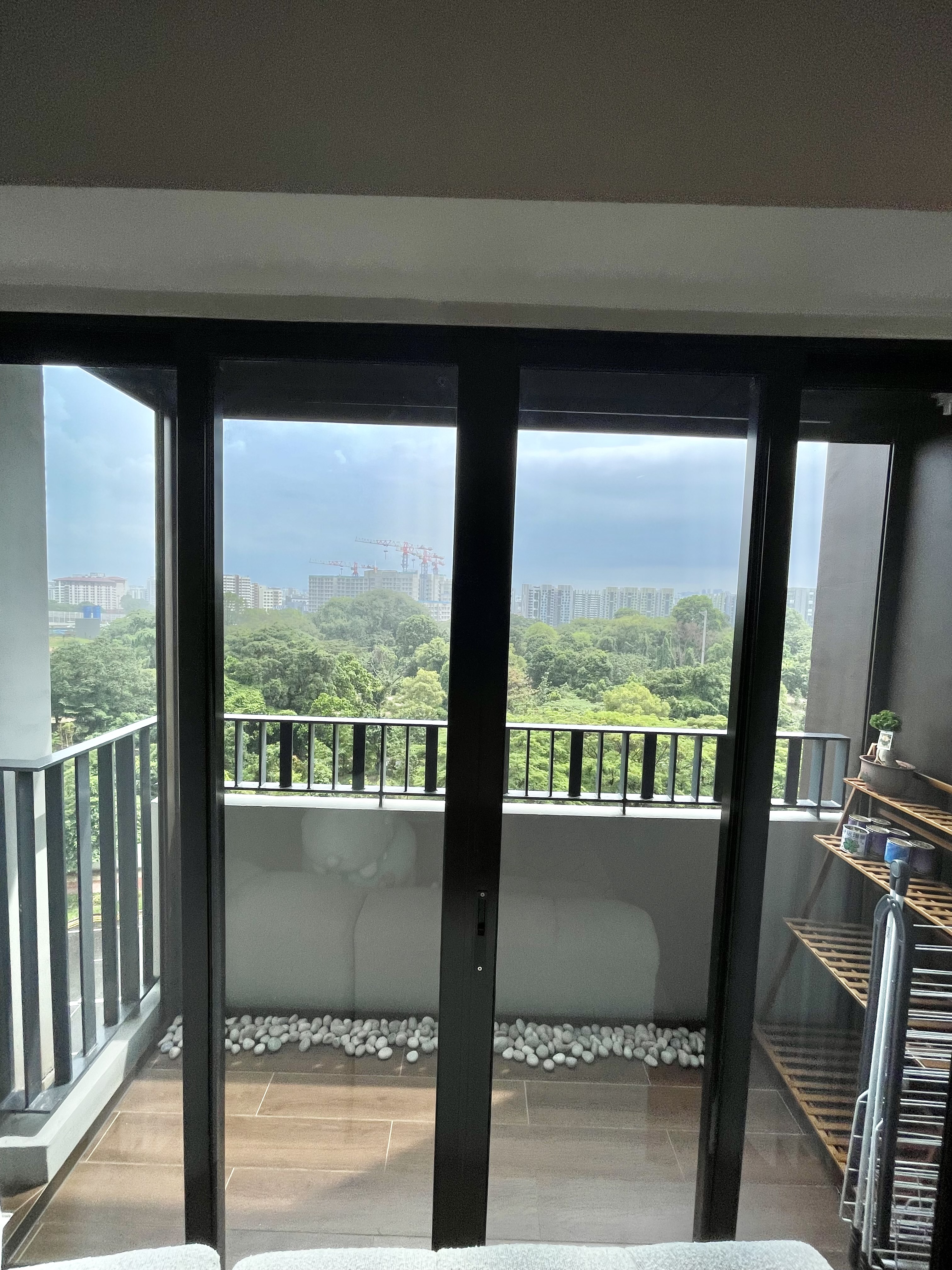 Our Japandi Lounge: A Blend Of Limewash Walls And Curved Fluted Panels - Glass doors, balcony, cityscape, green trees, cloudy