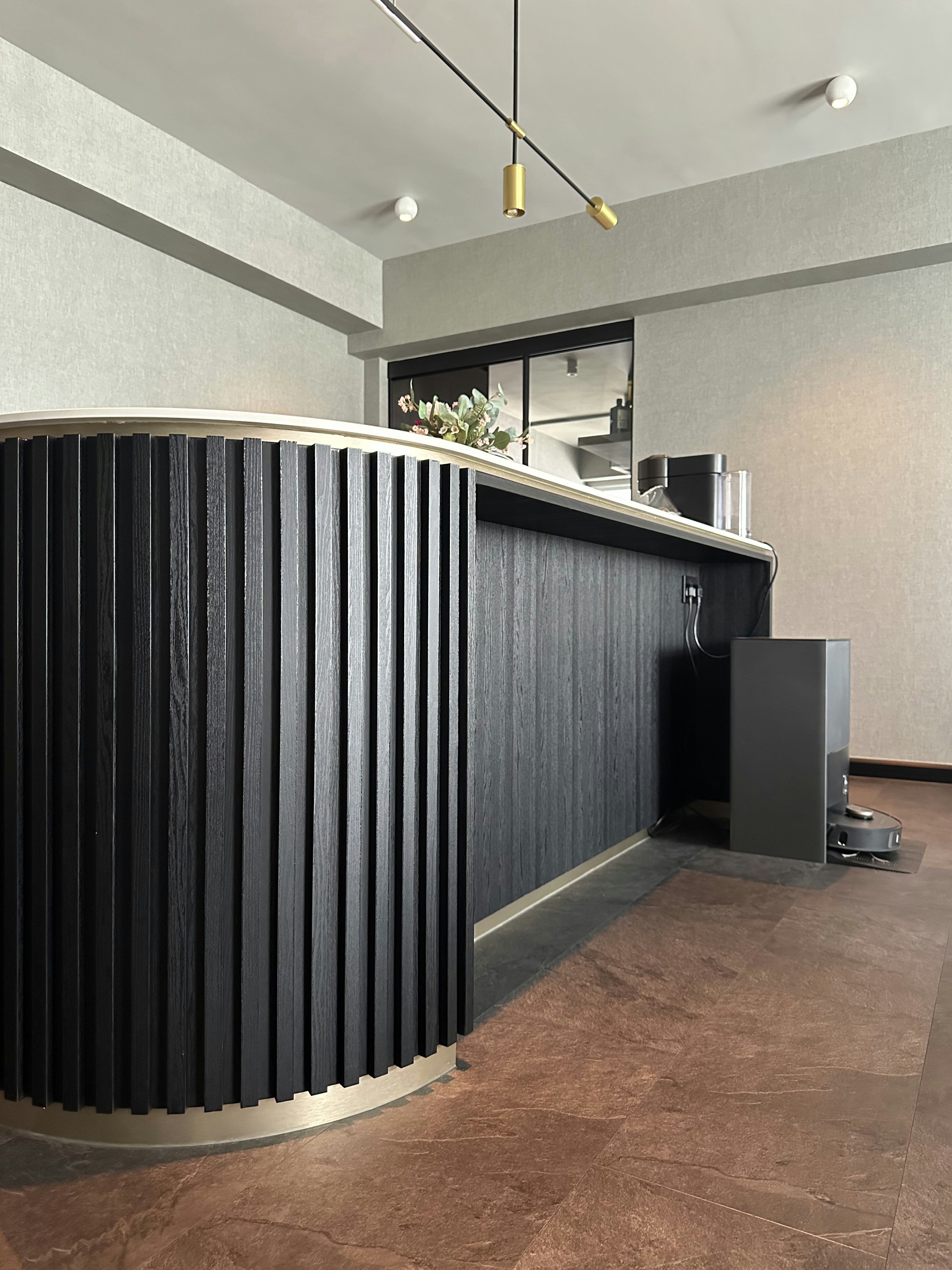 Living Room’s Centerpiece: Custom Island with Hidden Wine Chiller - modern bar counter, sleek black design, minimalist decor