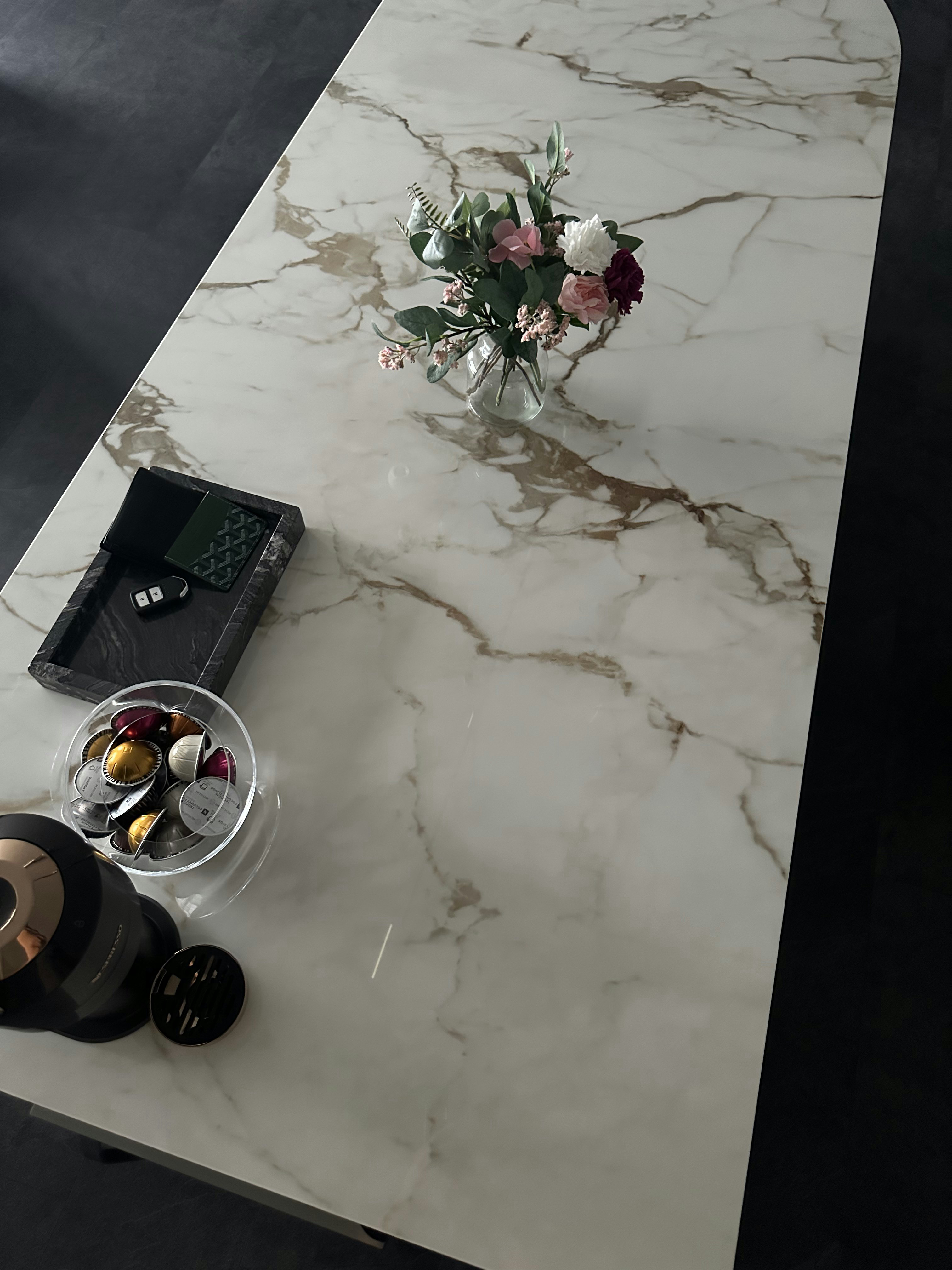 Living Room’s Centerpiece: Custom Island with Hidden Wine Chiller - Marble countertop, modern design, elegant table setting