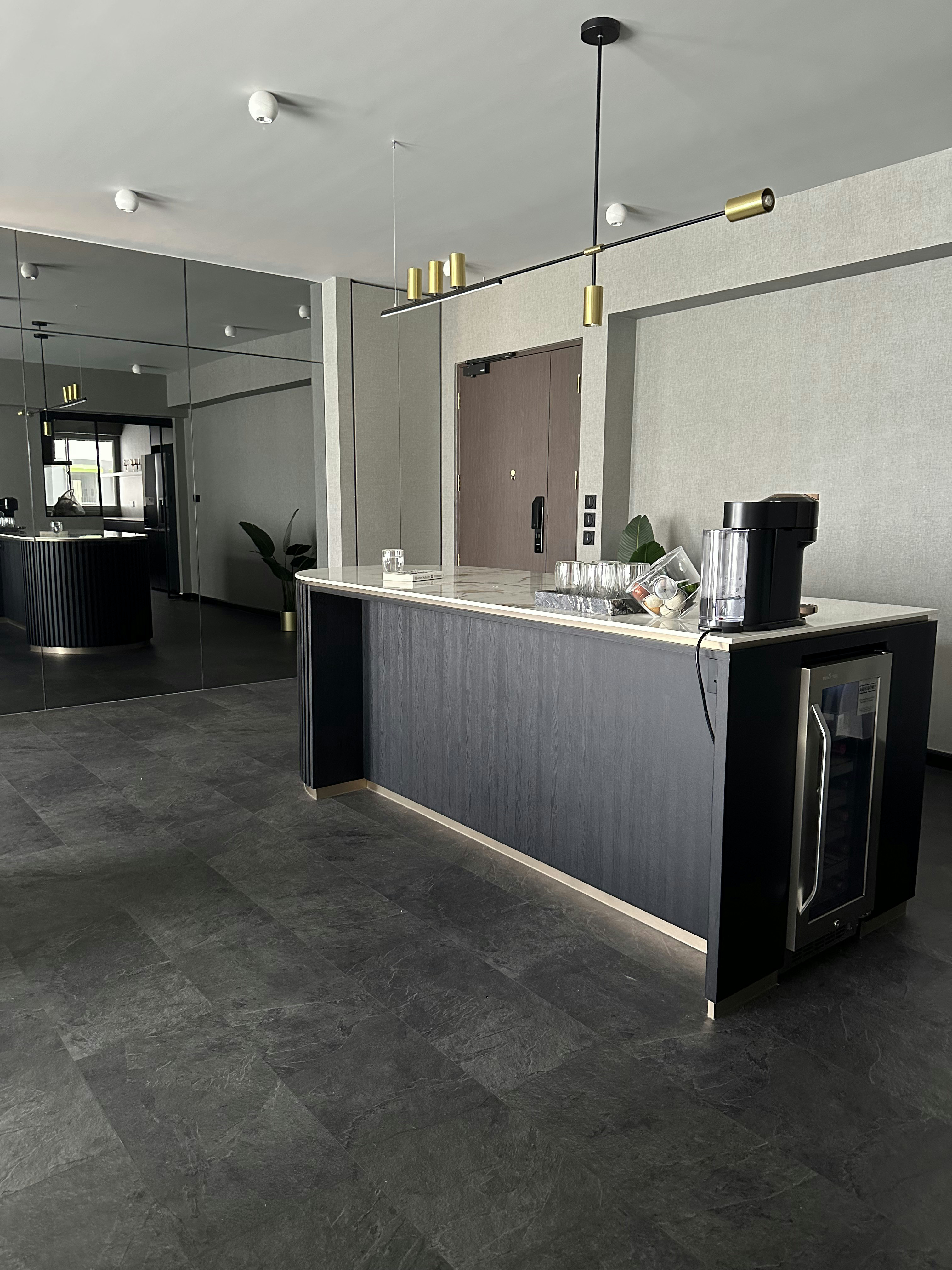 Living Room’s Centerpiece: Custom Island with Hidden Wine Chiller - Modern kitchen island, sleek design, minimalist decor